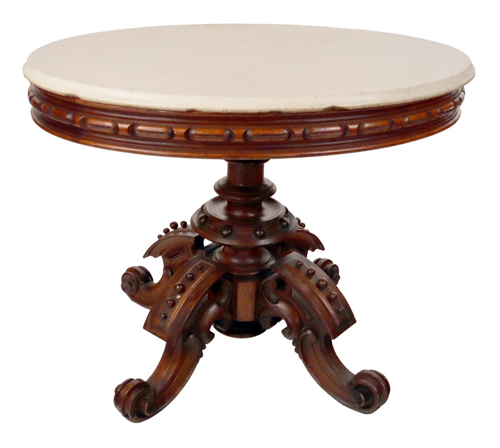 Thomas Brooks Attrib. Victorian Marble Top Table: Thomas Brooks (American, 1811-1887) attributed Victorian marble top center table, 19th century with beveled marble top, carved apron, and a heavily carved and mounted and ball beaded and four-scroll