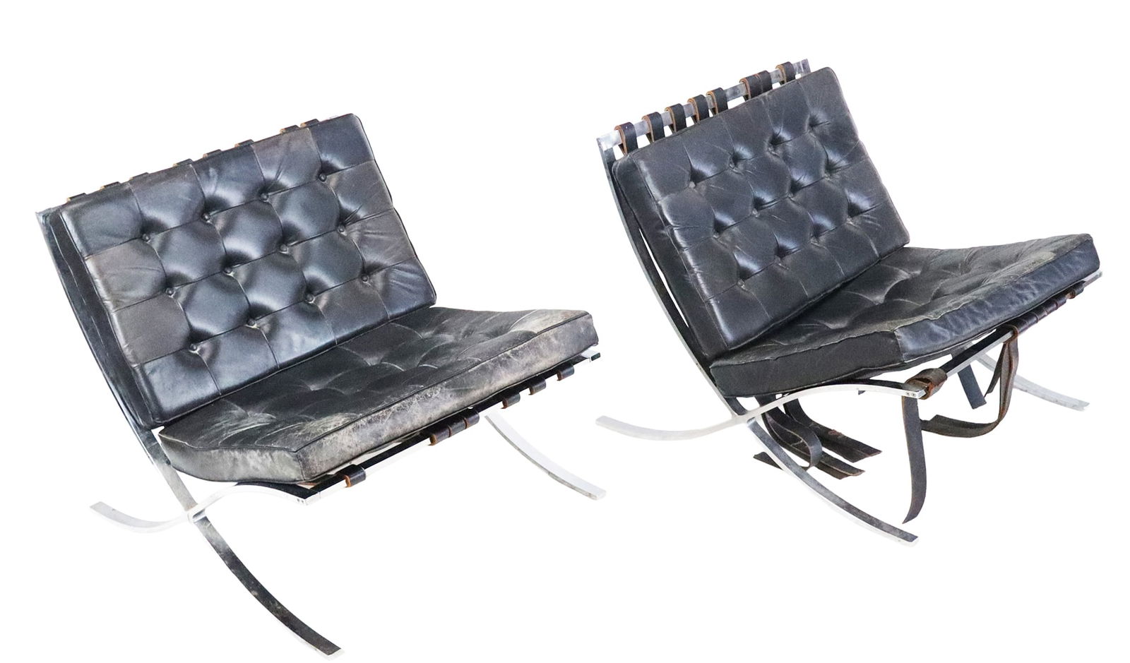 Barcelona Chairs - Pair: Barcelona Chairs, Pair, designed by Mies van der Rohe, classic styling of the Barcelona chair, incomplete tag states distributed by Stratford Company, Albany Miss, Leather straps and seats on curved