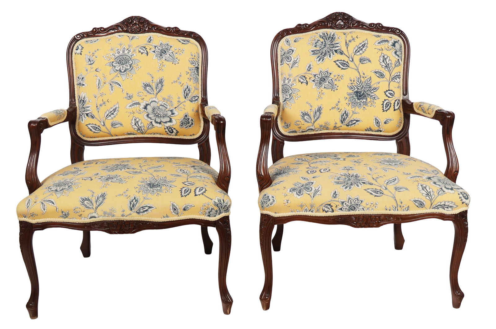Pair of Louis XV Upholstered Fauteuils: Pair of Louis XV upholstered fauteuils, 21st century, with floral upholstery and carved frames. [38" H x 27" W x 25" D; seat height: 18"]. Condition to each is good.