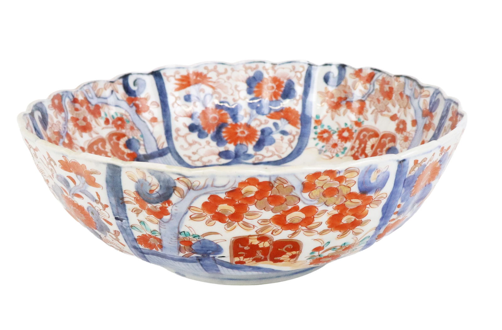Japanese Imari Porcelain Center Bowl: Japanese Imari porcelain center bowl, 20th century, with blue white and red design and a scalloped edge, unmarked. [5" H x 12.25" Diameter]. Condition is good with some minor fading.