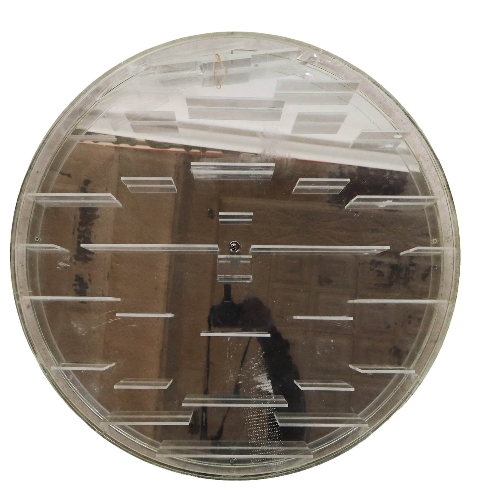 Lucite and Mirror Backed Display Case: Lucite and mirror backed display case, 21st century, with shelves to interior and a locking mechanism. [25.5" Diameter x 3" D]. Condition is good with some surface wear; key absent.