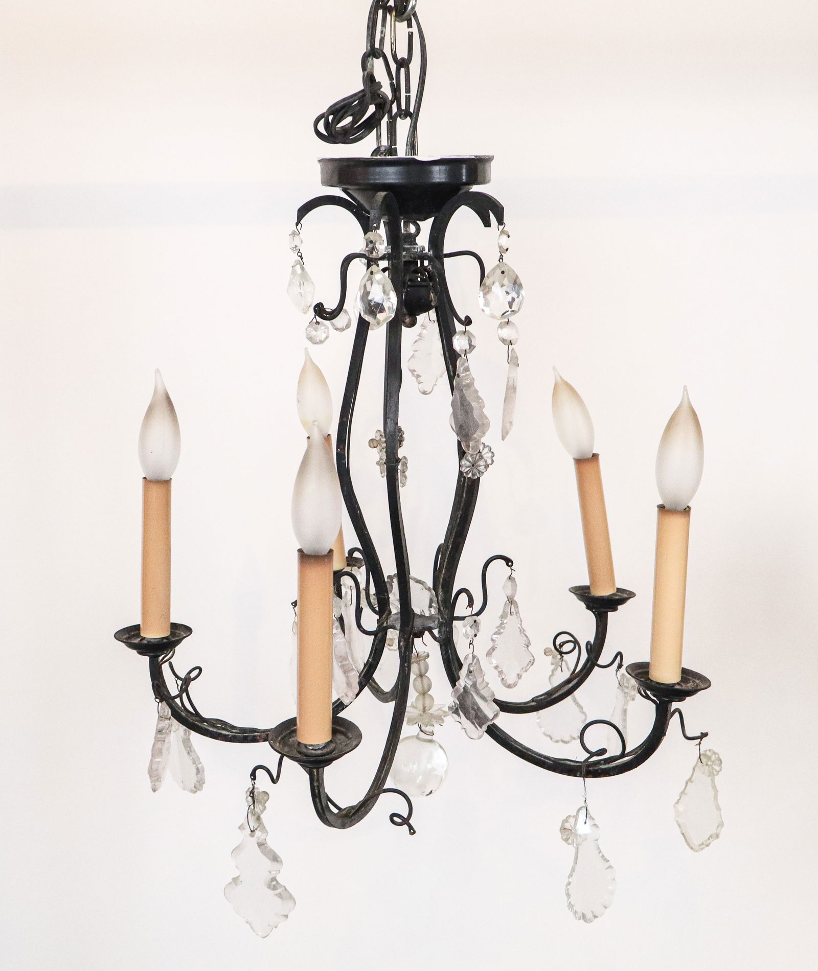 Metal and Cut Crystal Five Light Chandlier: Metal and cut crystal five-light chandelier, 20th century, with faceted and cut crystal accents. [Less chain: 18" H x 18" Diameter]. Condition is fair with residue and losses; wiring untested.