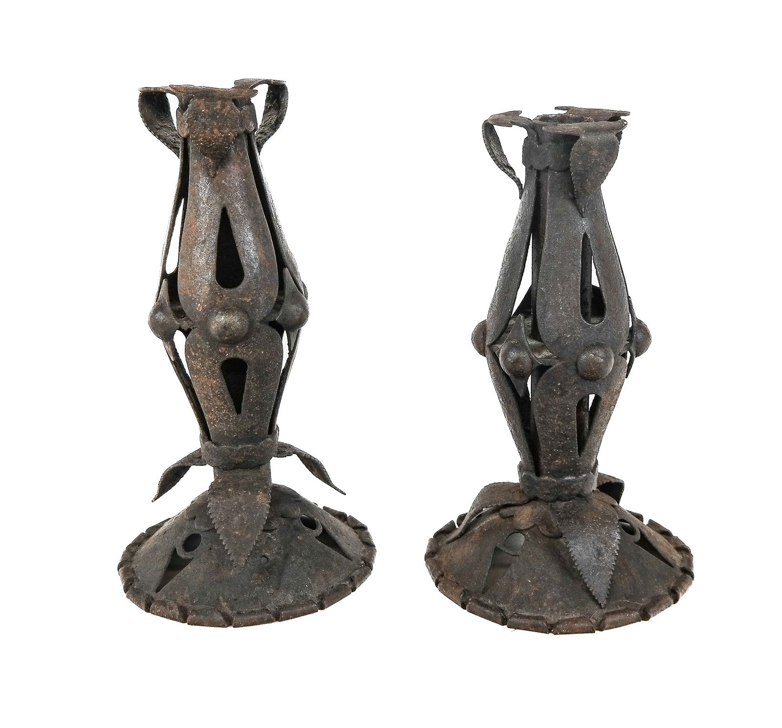 Pair of Gothic Revival Iron Candlestick: Pair of Gothic revival iron candlesticks, Spanish, 19th century, with leaf decoration. [8.5" H x 5" Diameter]. Condition to each is good with minor rust throughout. From the Collection of Sue and