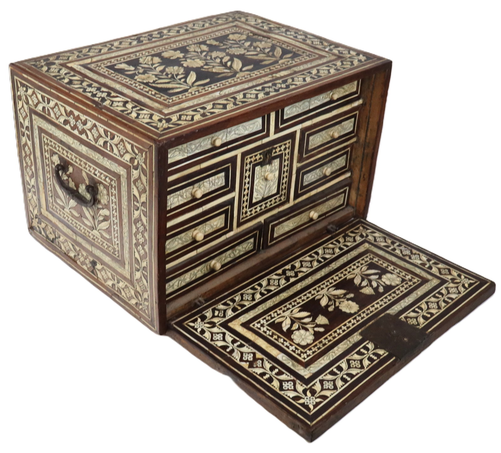 Anglo Indian Bone Inlay Fall Front Box: Anglo Indian bone inlay box (possibly a small vargueno chest top), all over incised bone inlays on mahogany, with a fall front opening to multiple size drawers, on small wood feet. Wrought iron handle