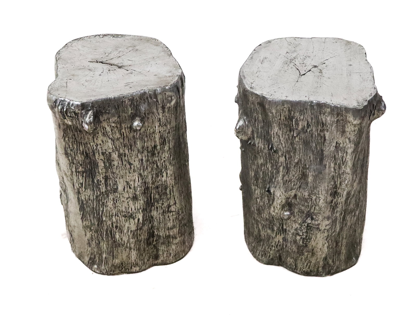 Pair Modernist Silvered Faux Trunk Form Posts/Stan: Pair Silvered composition, tree trunk form posts or stands, molded and silver gilt, as stands, or posts, or table bases. No signatures found. [17" H x 11" diameter]. Scratches and one chip on one poin