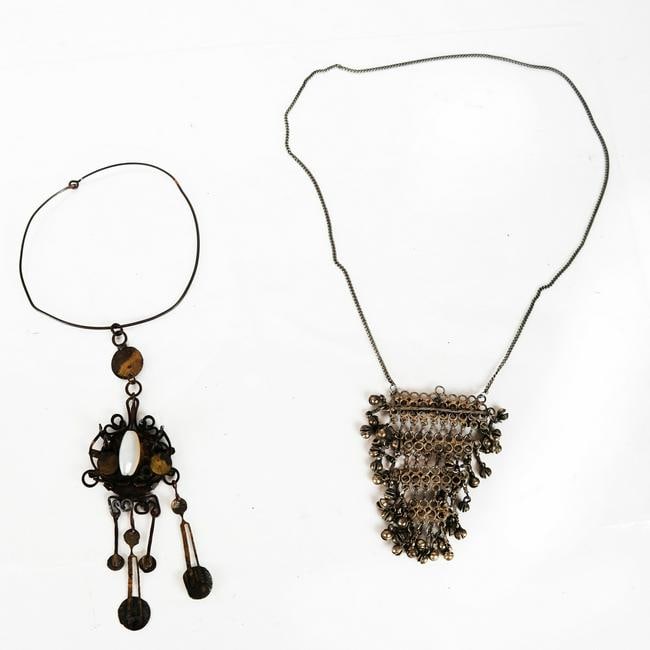 Two Vintage Art & Ethnographic Necklaces: Two vintage necklaces, including a Tibetan silver pendant on a metal chain [Chain: 32" L] and a copper circlet with a modern style pendant with an opaline glass stone [Pendant: 8" L]. Both with tarnis