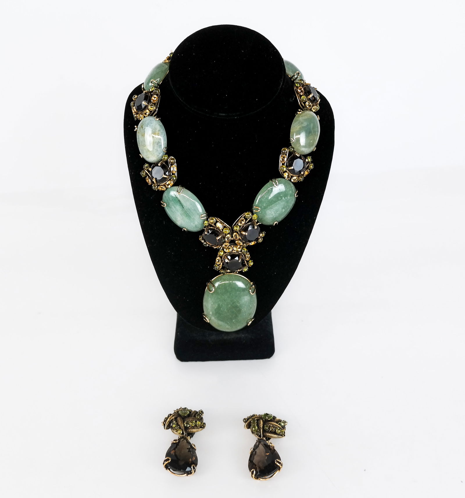 Bounkit Multicolored Gemstone Necklace and Earring: Bounkit multicolored faceted and cabochon gemstone necklace and ear clips set, set in fall tones of green, gold, brown and orange, signed [Necklace: 15" L, ear clips: 2.25" L] Overall condition is goo