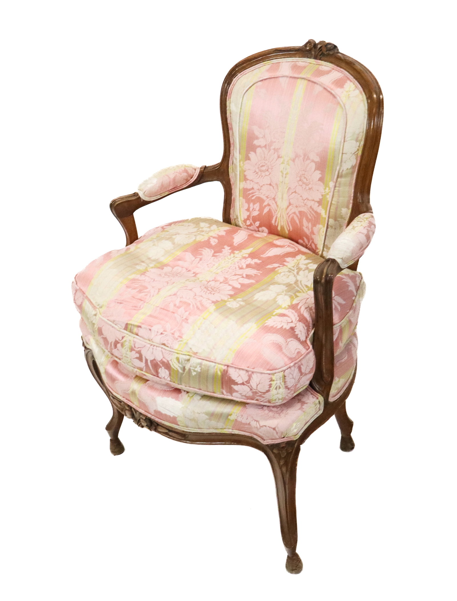 French Carved Fauteuil: French carved fauteuil, silk floral and stripe upholstered and padded arms, down cushion, carved fruitwood frames. [37" H x 26" W x 25" D]. Good condition, arm pads worn.