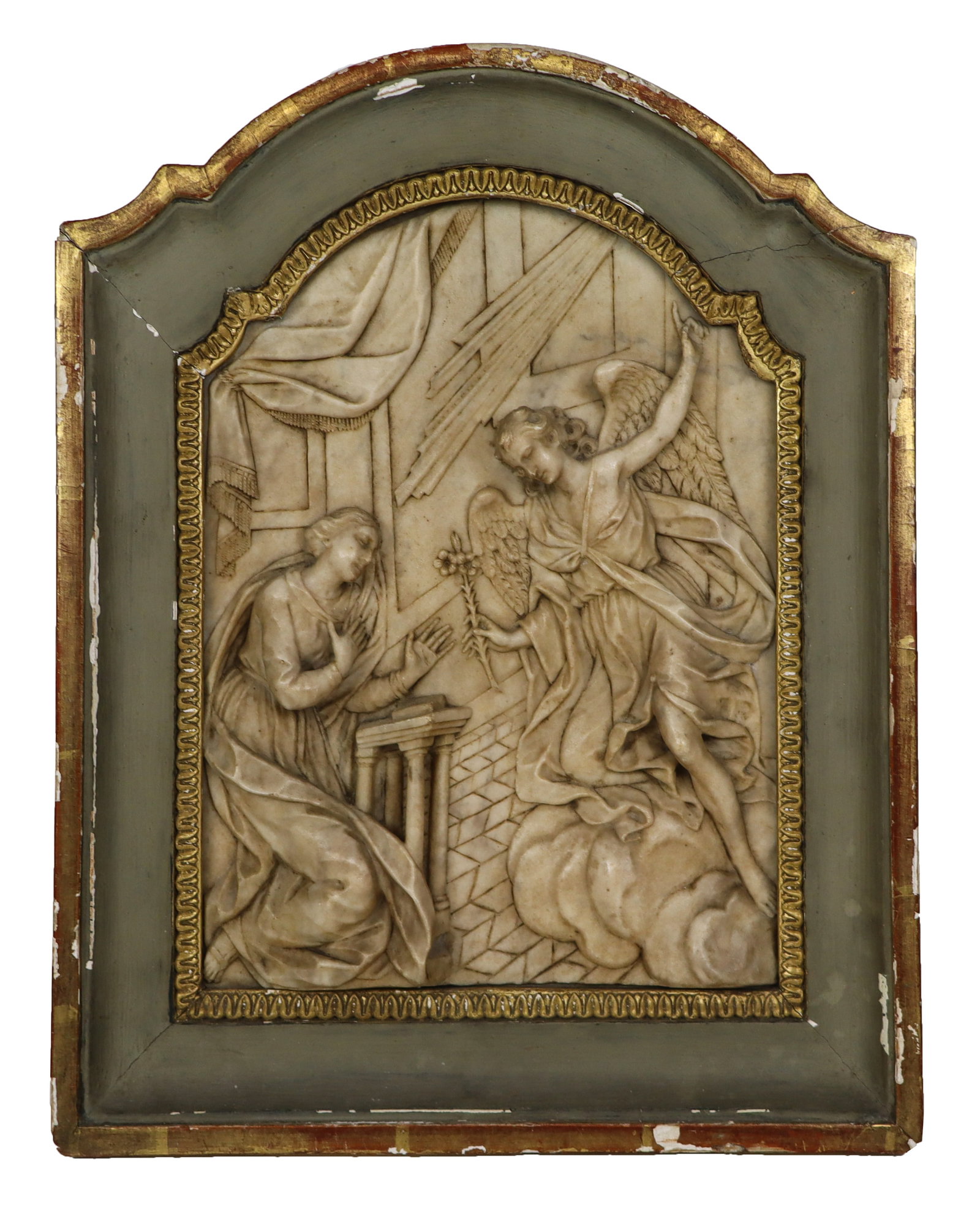 Antique Carved Marble Plaque of "The Annunciation": Carved marble plaque of "The Annunciation" in a carved, painted and gilded frame, probably Italian, early 19th century, carved in deep relief depicting the Angel Gabriel where he annouces to Virgin Ma