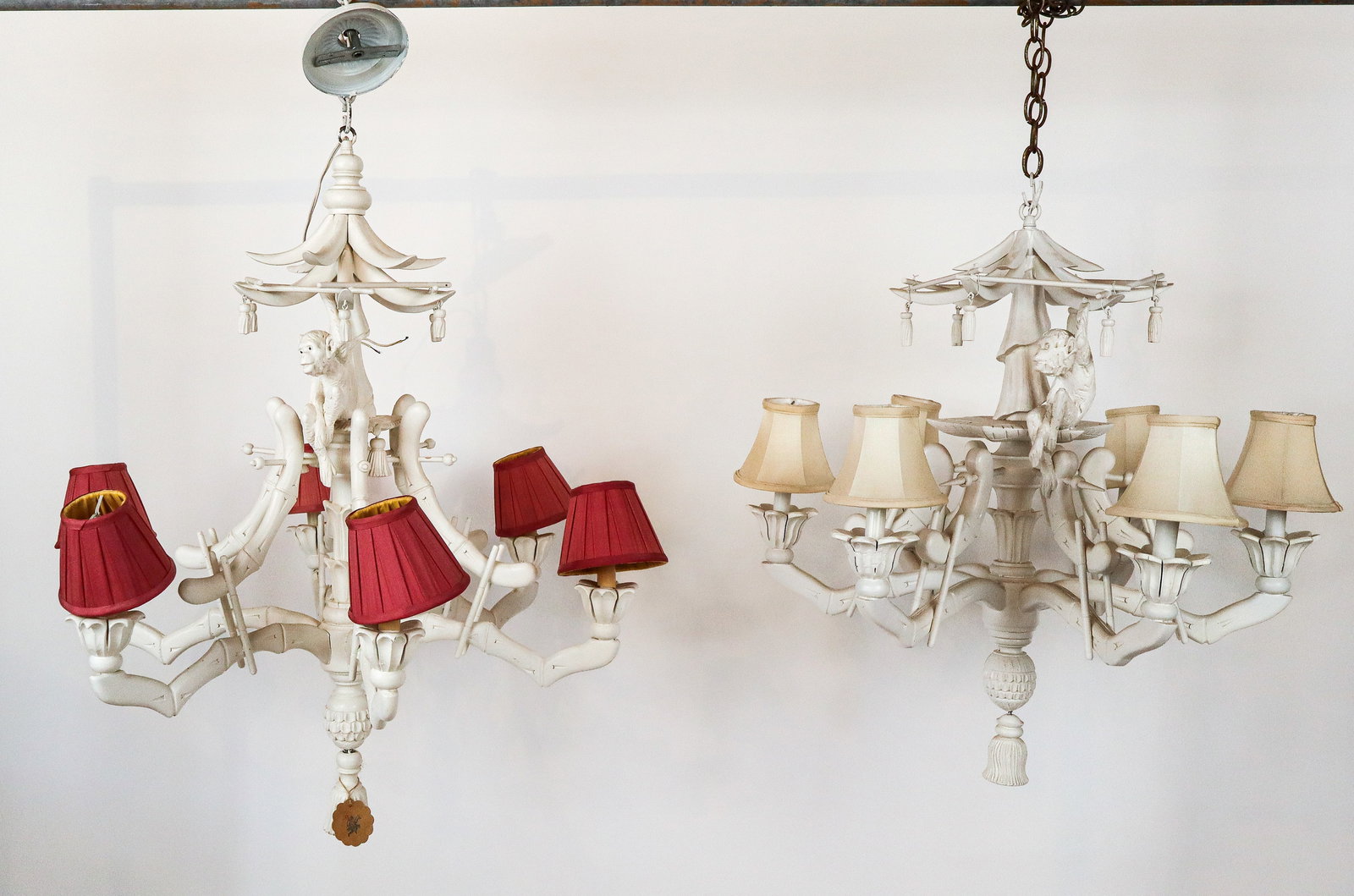 Pair Chinoiserie Carved & Painted Wood Chandeliers: Pair of Chinoiserie carved and painted wood chandeliers, 20th century, with monkey decoration, and bamboo carved girandole arms, with six lights. [Larger: 34" H x 30" Diameter; smaller: 29" H x 28" Di