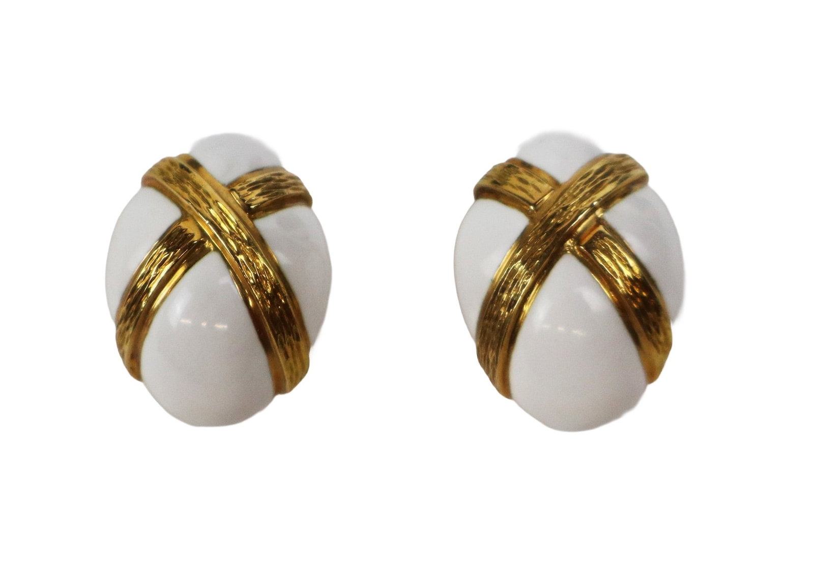 David Webb Pair of Enamel and Gold Ear Clips: David Webb pair of white enamel and textured 18K gold ear clips, signed on clip backs Webb 18K. [Total 18.9 dwt.,1" L x .75" W]. Overall condition is good. Property from the family of Leonard Bernstei