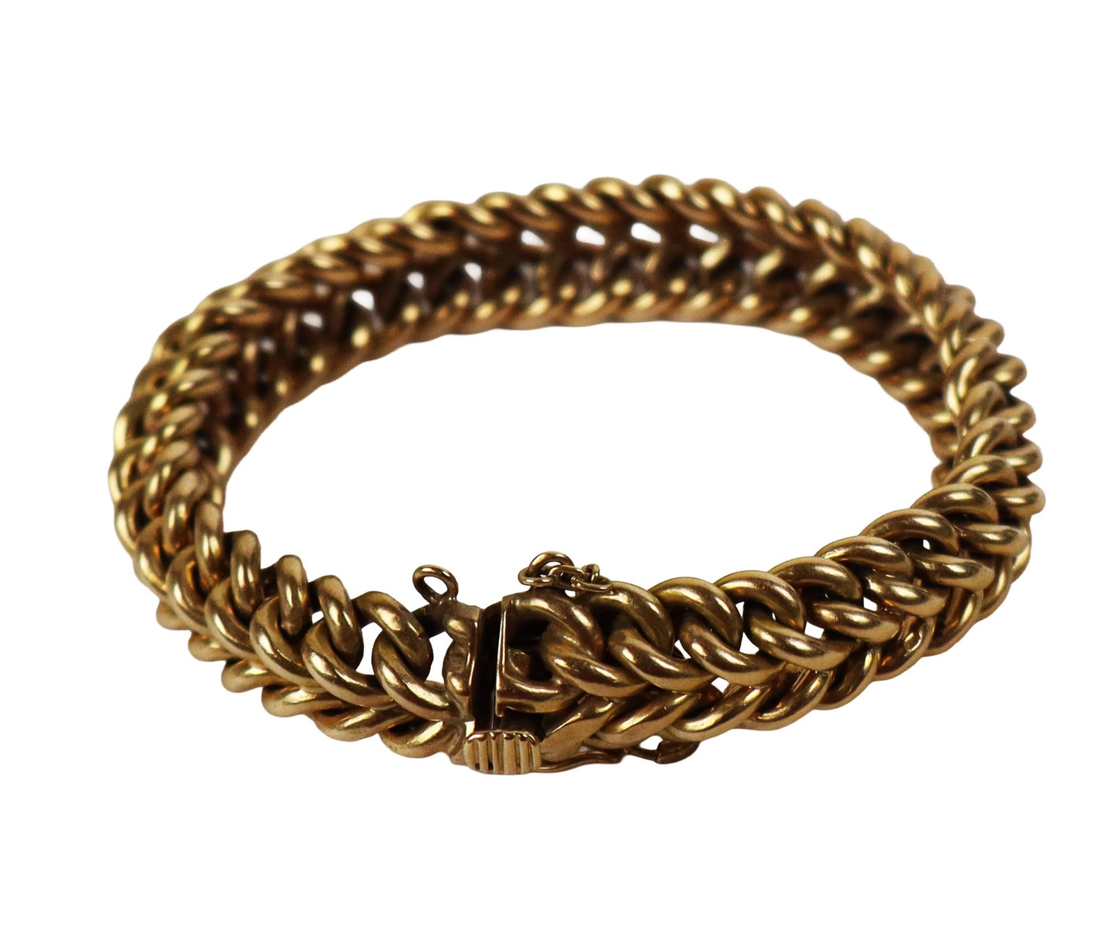 Gold Woven Bracelet: 18K gold woven or braided link bracelet, marked 18K. [57 dwt., 7.25" L]. Overall condition is good, with 2 safety mechanisms, stress crack to tongue clasp. Property from the family of Leonard Bernstei