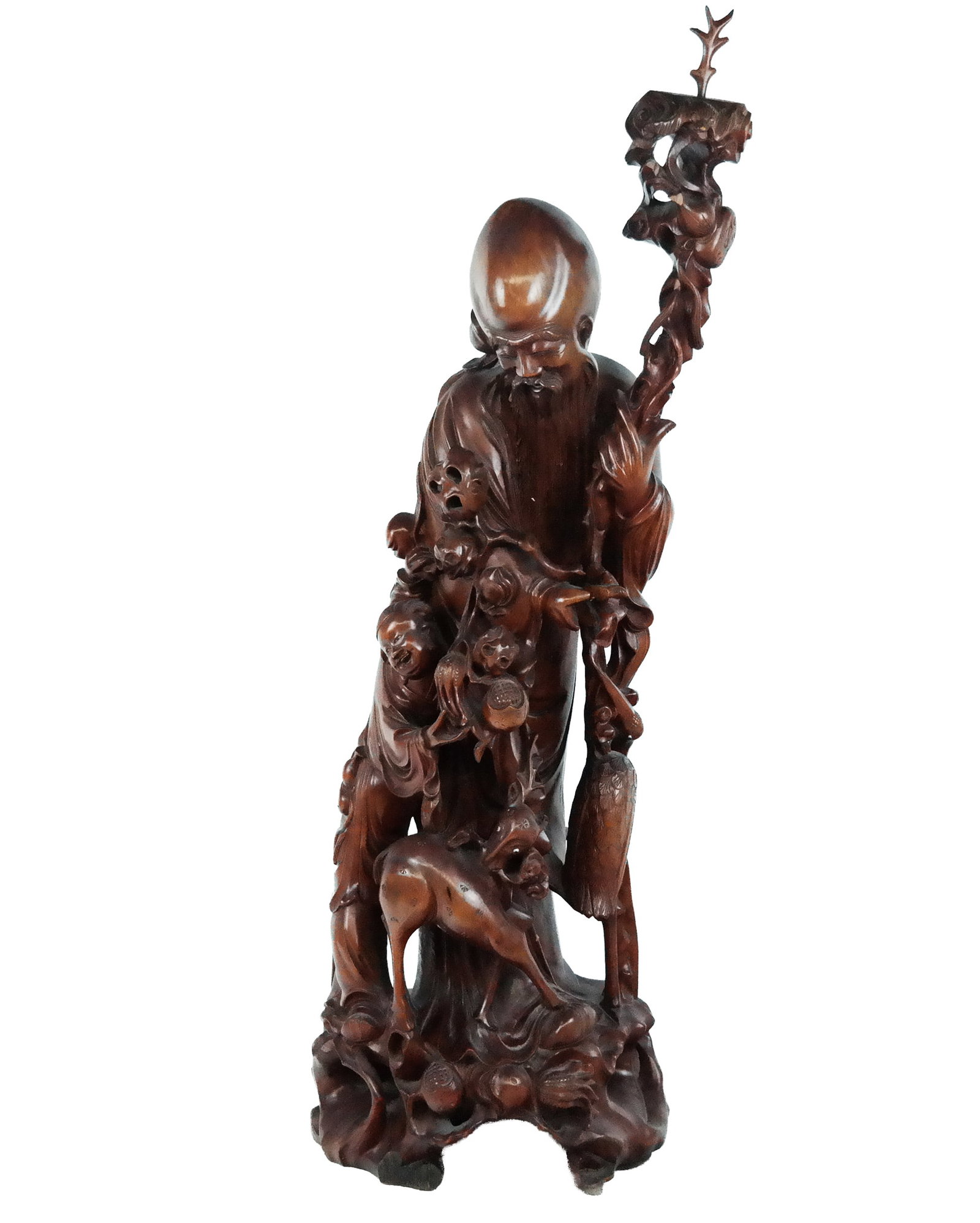Chinese Carved Fruitwood Sculpture of Shou Xing: Chinese carved fruitwood sculpture of Shou Xing, 20th century, accompanied by a child, Tangzxi, and a deer. [29" H x 13" W x 9" D]. Condition is fair with a break to upper, a loss to one antler at