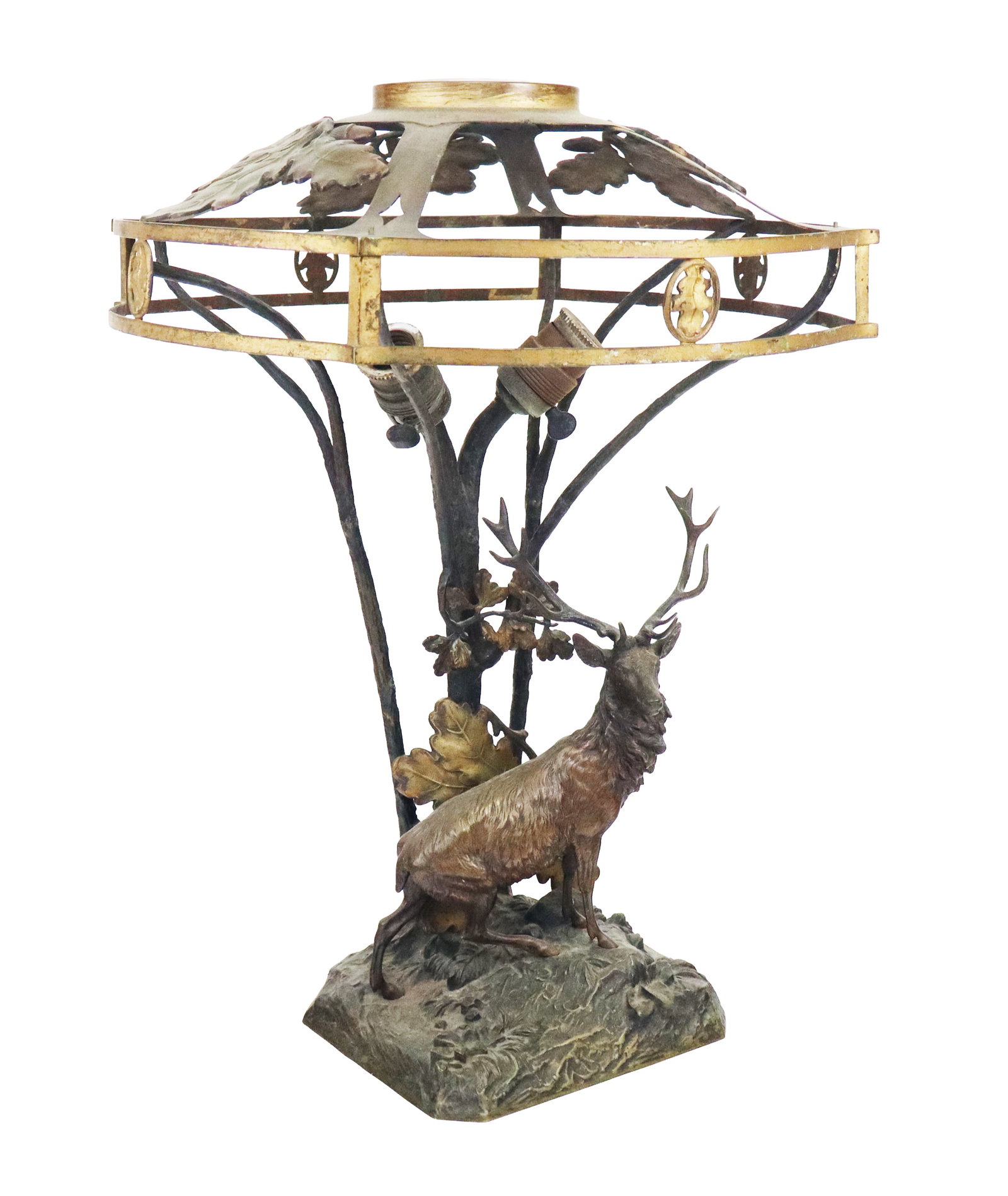 Arts & Crafts Mixed Metal Figural Lamp: Arts & Crafts mixed metal lamp, a naturalistic base and tree form lamp with mounted large male deer, with a oak leaf and acorn mounted round edge squared shade (no inserts). [21" H x 17" Diameter at s