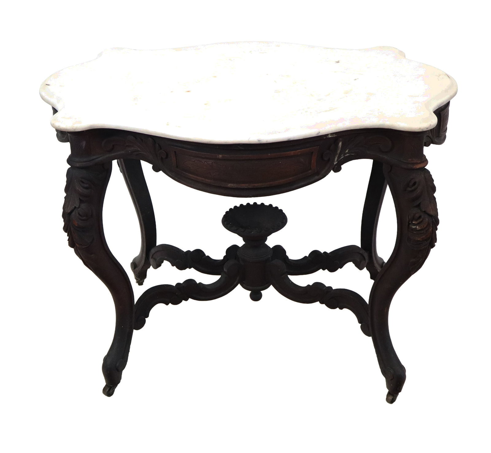 Victorian Marble Top Center Table: Victorian marble top center table, white marble turtle shaped and beveled top on a carved mahogany four leg table with compote center stretcher, on casters. [30" H x 40" x 29"]. Age wear in lower extr