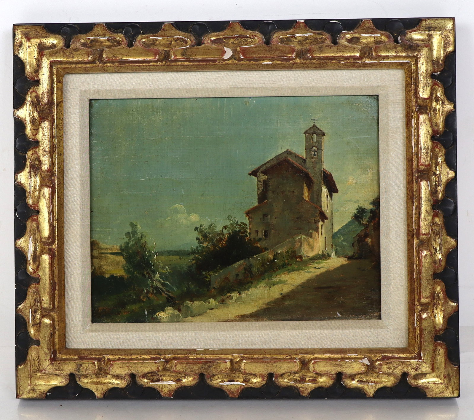 Late 19th C. European School Landscape with Church: Late 19th-early 20th century oil on canvas painting depicting a rural landscape with a church on a hill, no apparent signature, gilt framed. [Sight: 6.25" H x 8.25" W; Frame: 10.5" H x 12.5" W]. Possi