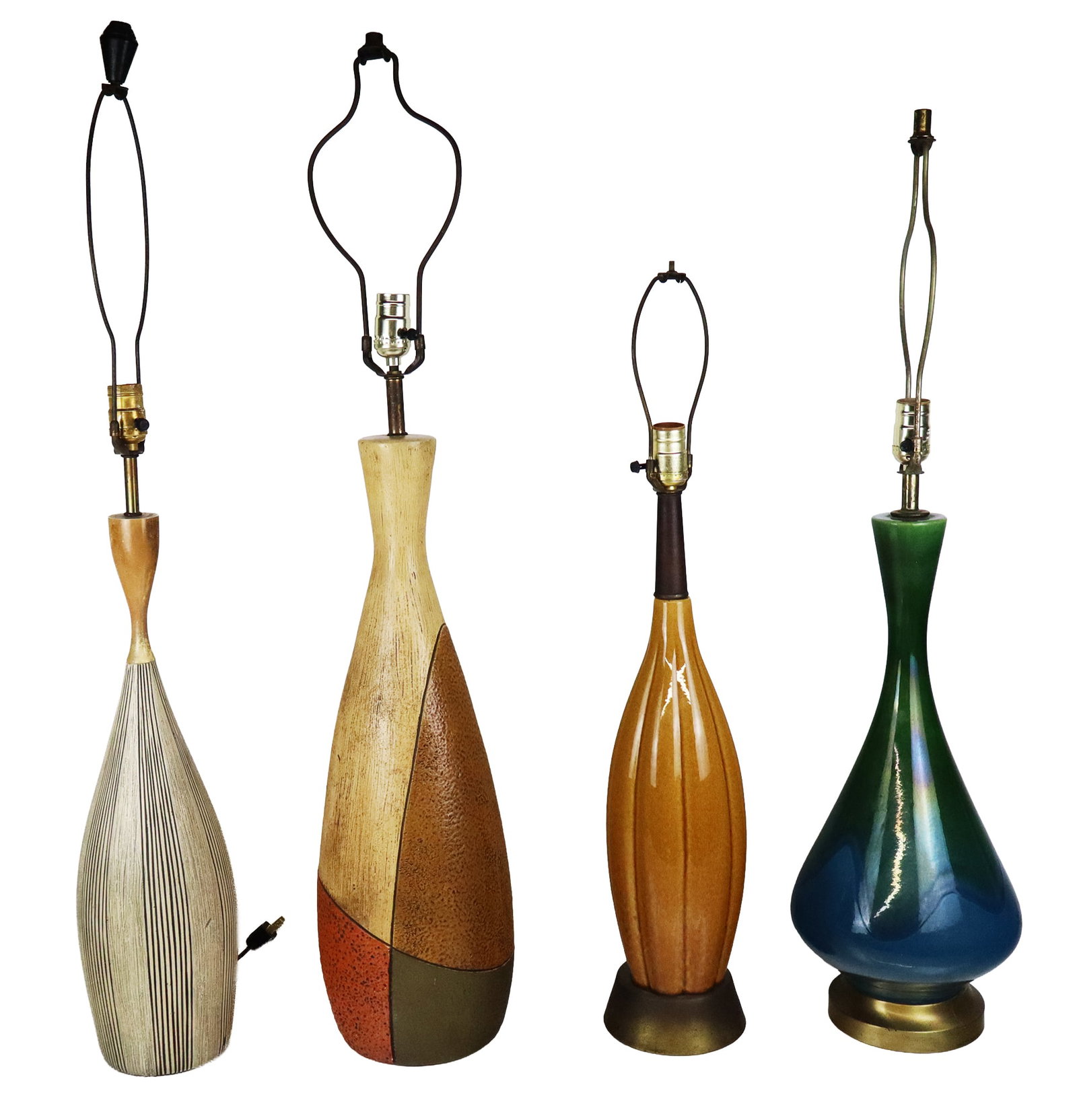 Four Mid-Century Modern Lamps: Four porcelain Mid-Century Modern lamps, mid-20th century, all unmarked. [Tallest, less harp: 28" H x 8" Diameter]. Condition throughout is good, some with light wear, wiring untested.