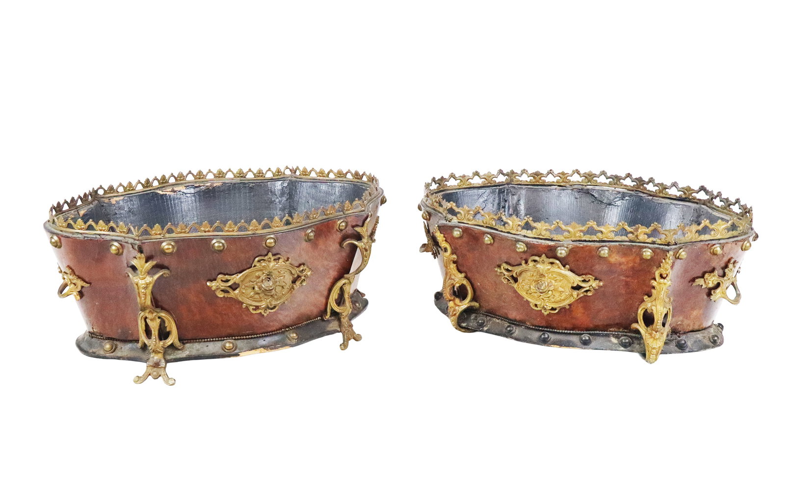 Pair of Louis Philippe Mahogany Jardinieres: Pair of Louis Philippe mahogany and gilt metal jardinieres, late 19th century, of cartouche outline, accented with a pierced anthemion border and foliate motifs, the black painted wood interiors.