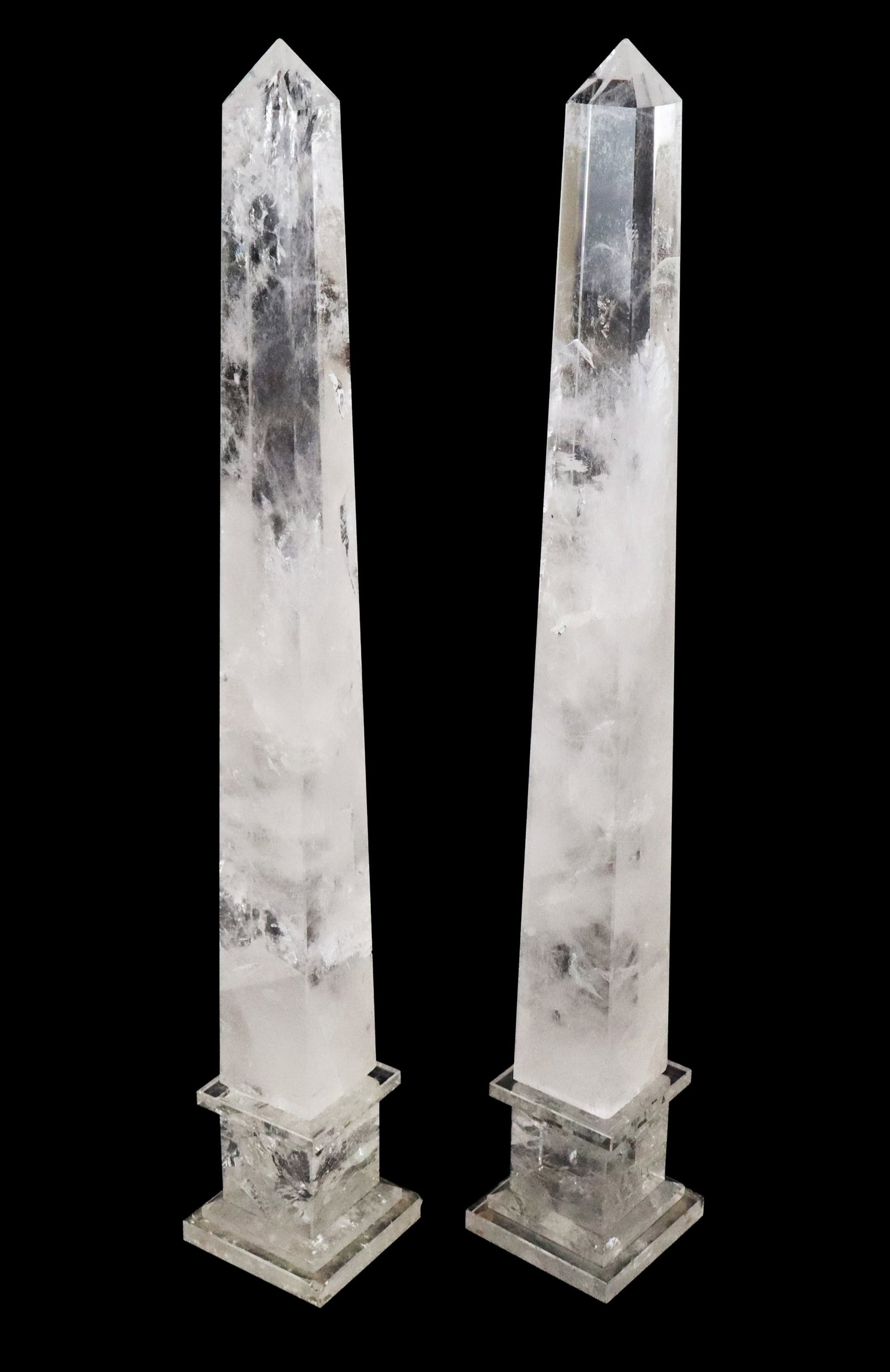 Pair of Rock Crystal Obelisks: Pair of rock crystal obelisks, 21st century, with stepped plinth to lower, marked in Dutch at label. [22.5" H x 3.5" Square]. Condition to each is good with some minor chips and fleabites. From the es