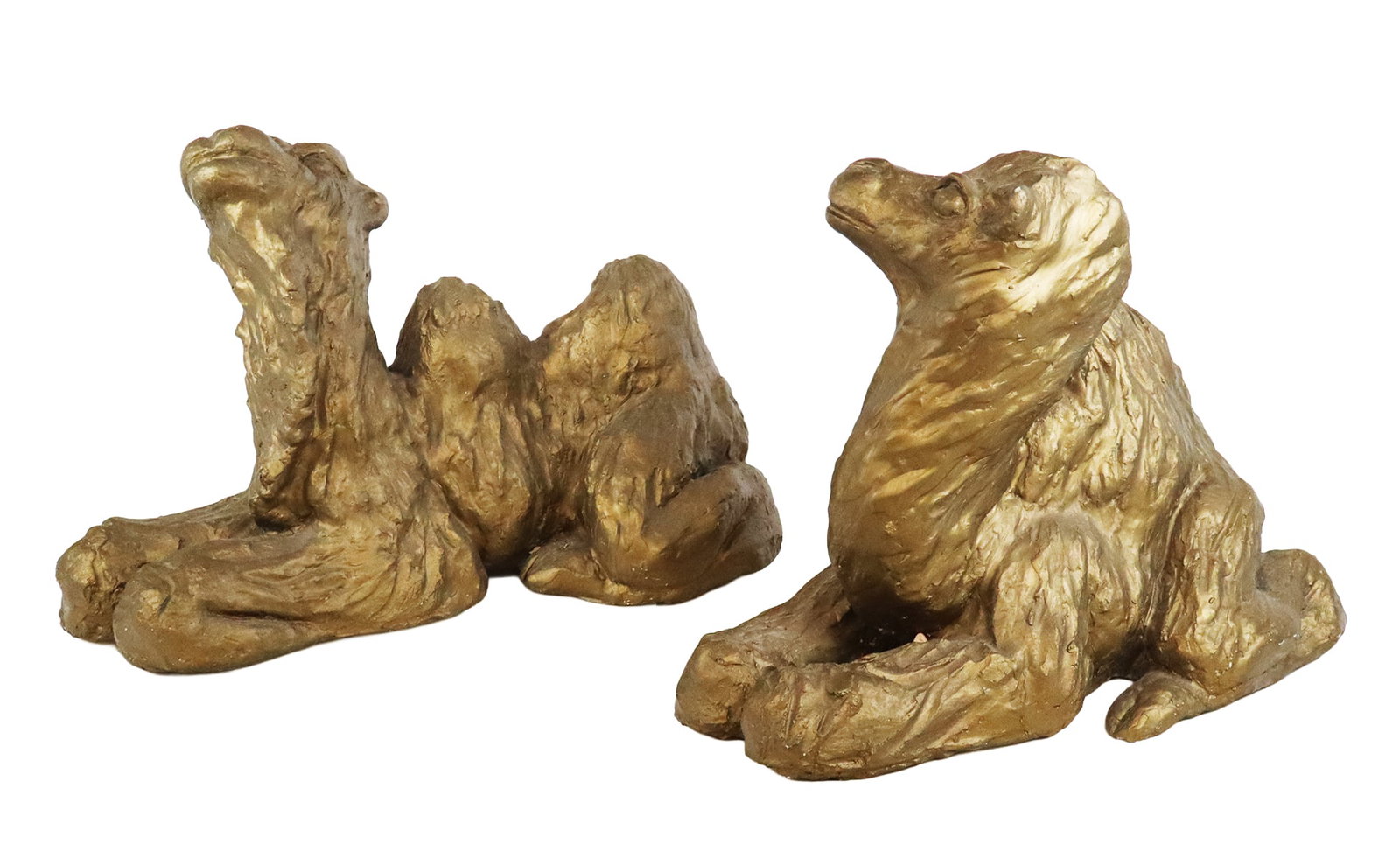 Pair of Faux Bronze Dromedary Camels: Pair of dromedary camels with plaster construction and a faux bronze finish, 20th century, unsigned. [14" H x 18" W x 10" D]. Condition to each is good. From the esteemed collection of Neil Zukerman f