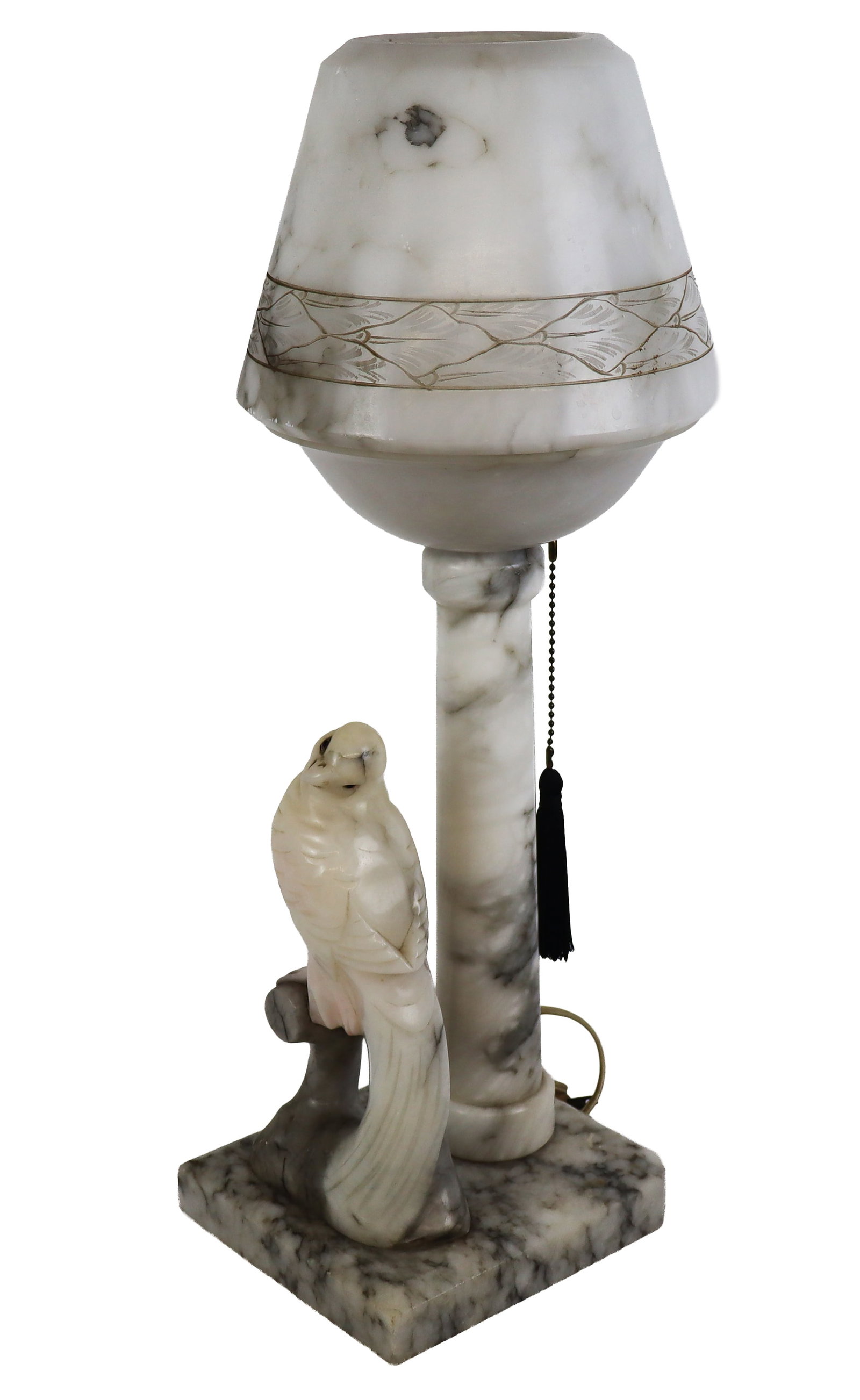 Art Deco Carved Marble Lamp with Cockatoo: Art Deco carved marble lamp, early 20th century, with a carved and etched marble shade, stand, and base, and carved cockatoo detail to lower and later tassel chain. [22" H x 7.25" W x 6.5" D]. Conditi