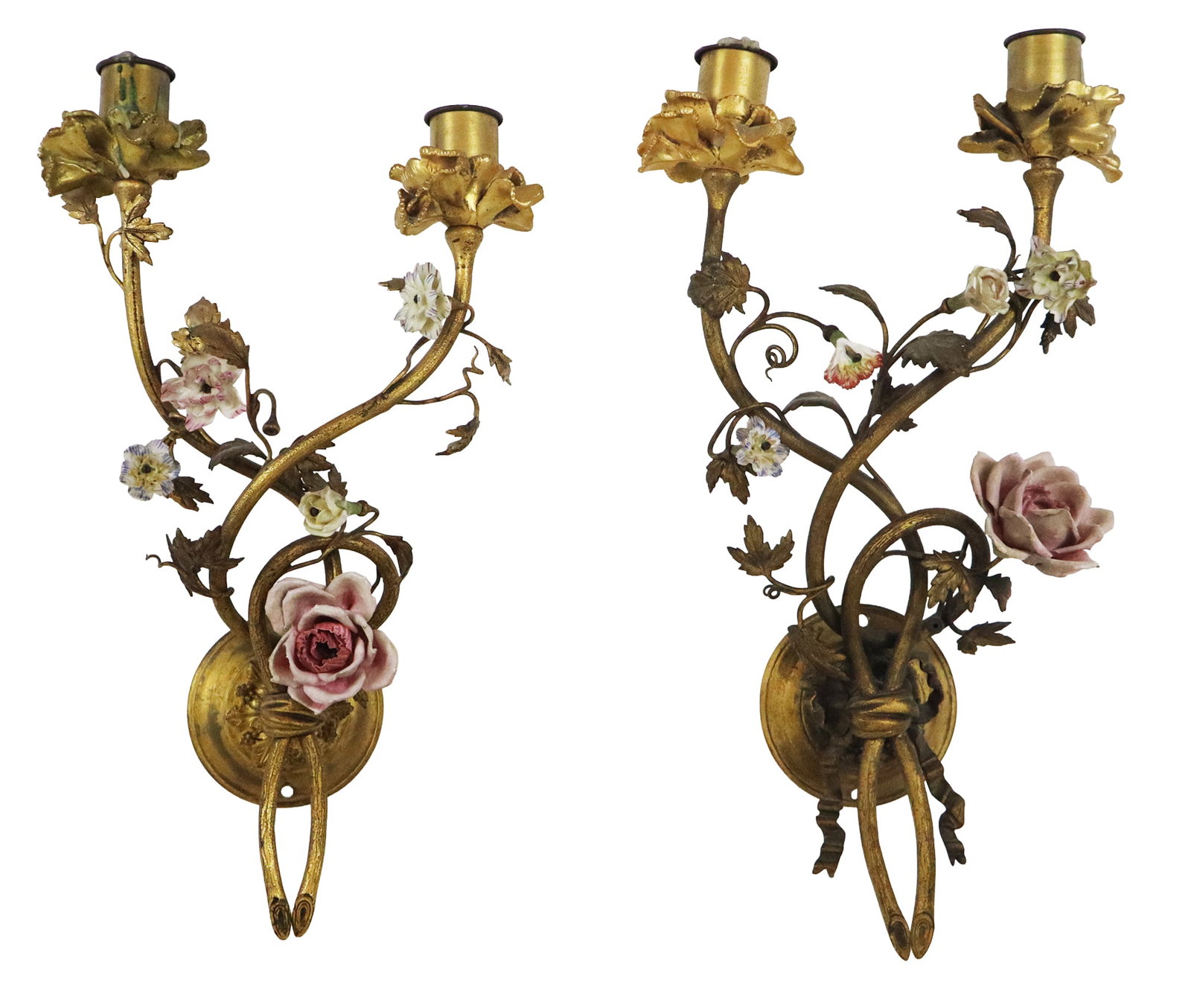 Pair of Bronze Dore and Porcelain Floral Sconces: Pair of bronze dore and porcelain floral decorated sconces, France, 19th century, with two candlestick holders, one less ribbon at lower, not electrified. [16.5" H x 10" W x 5" D]. Condition is good w