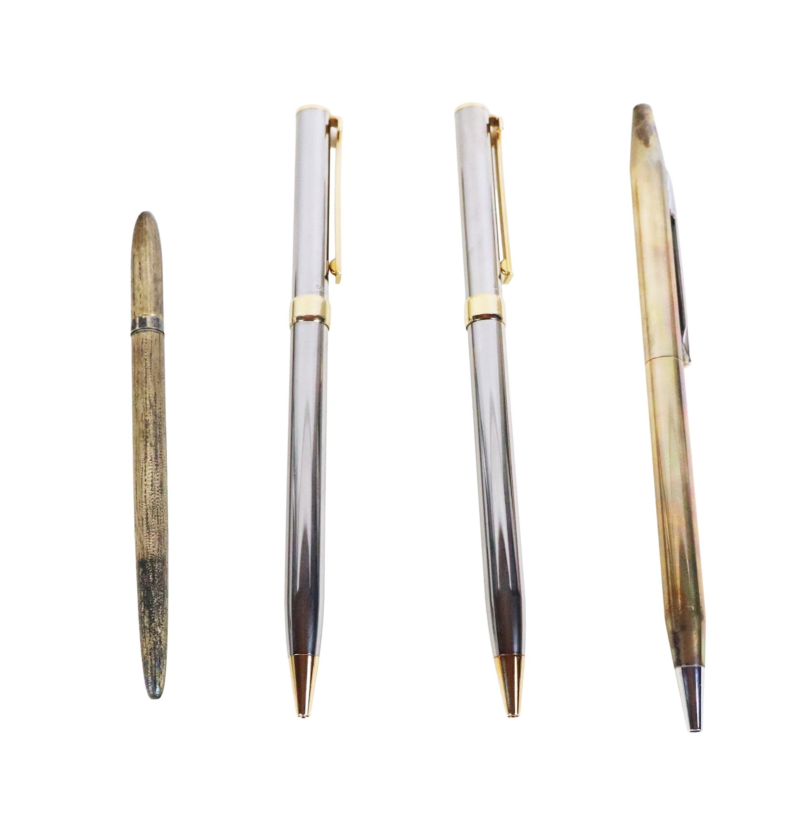 Tiffany & Co. Group of Four Assorted Pens: Tiffany & Co. group of assorted writing instruments, comprising two chrome and brass "T" Clip pens, vintage sterling silver twist ball point pen, and a vintage sterling silver textured ball point pen,