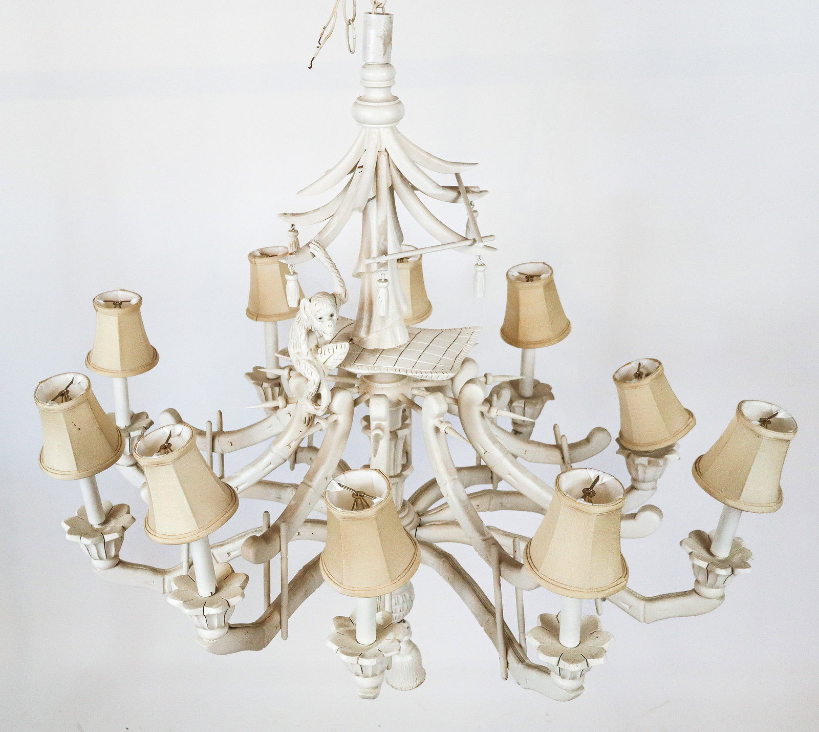 Chinoiserie Carved and Painted Wood Chandelier: Chinoiserie carved and painted wood chandelier, 20th century, with a monkey to upper, and bamboo form girandole arms, and ten lights. [Less chain: 39" H x 36" Diameter]. Condition is good; wiring unte