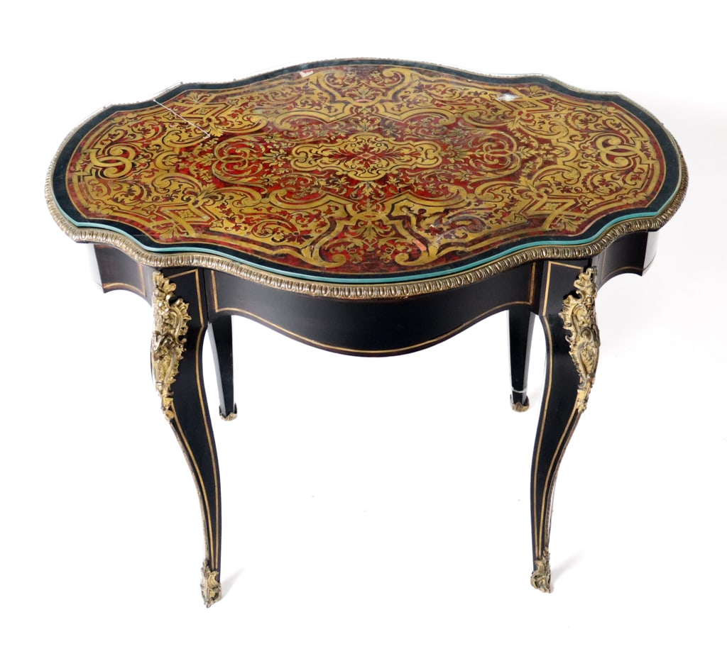 Louis Philippe Boulle Inlaid Table: Louis Philippe boulle inlaid table, 19th century, with elaborate brass inset decoration over inlaid apron, supported by bronze mounted and inlaid cabriole legs with ram's head decoration at upper, wit