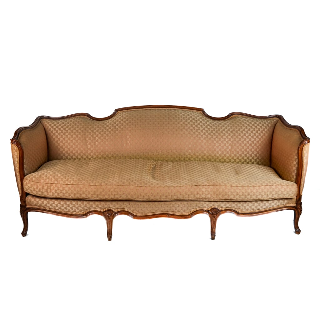 Louis XV-Style Upholstered Sofa: Louis XV-style upholstered sofa, mid-20th century, with carved frame and upholstered cushions. [32" H x 81" W x 32" D]. Scattered marks and wear to frame; fading and stains to upholstery.