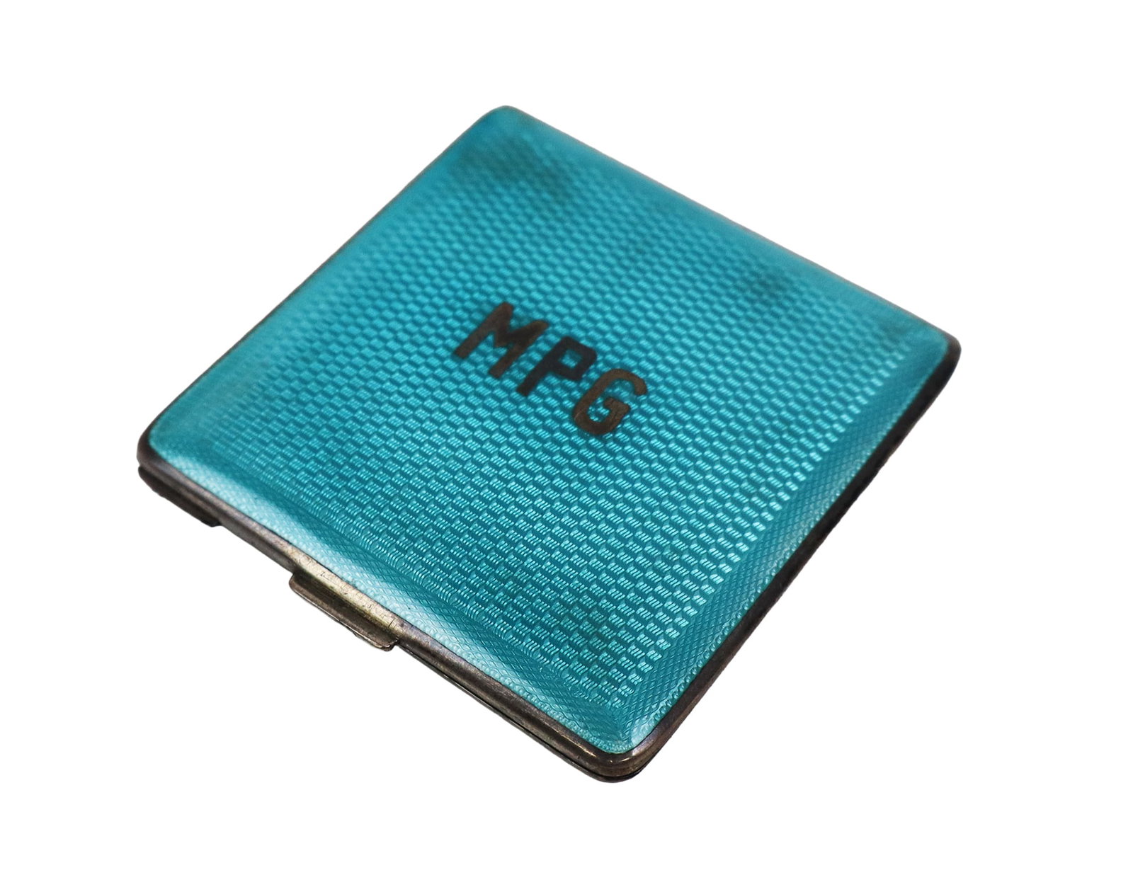 Austrian Silver & Turquoise Guilloche Compact: Austrian sterling silver and turquoise guilloche enamel monogrammed compact, hinged and with interior mirror, marked on the interior bottom of the case. [3.5 ozt., 2.5" Square]. Overall condition is g