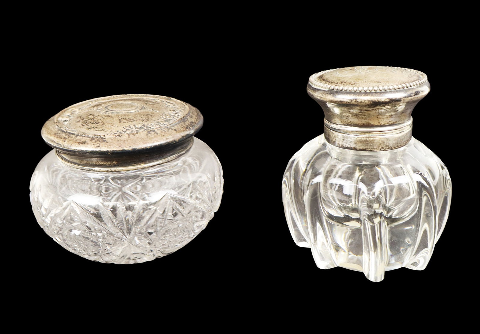 Sterling Silver and Glass Inkwell & Vanity Jar, 2: Sterling silver and glass covered inkwell [4.25" H x 4" Diameter], and a sterling silver and glass vanity jar [3.25" H x 4.25" Diameter]. Overall condition is good, inkwell missing interior liner, bot