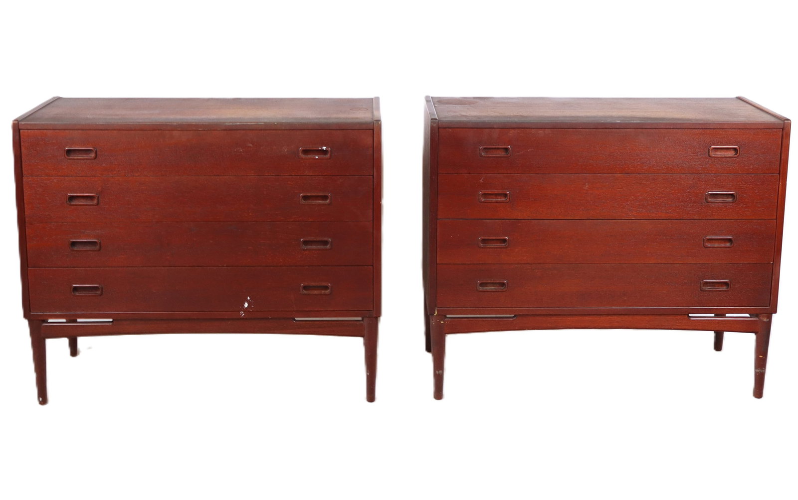 Mogens Kold Pair of Mid-Century Modern Commodes: Mogens Kold pair of Mid-Century Modern commodes, Denmark, mid-20th century, with teak veneer and four drawers, with Mogens Kold mark to lower reverse of one. [31" H x 36" W x 16" D]. Condition to each