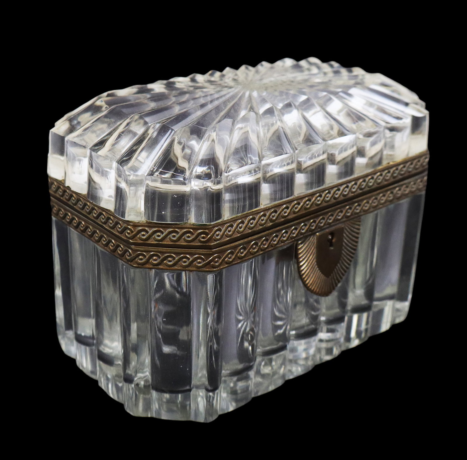 Baccarat Glass and Gilt Metal Box: Baccarat ribbed glass and gilt metal box, probably late 19th century, of rectangular outline with cut corners, unsigned. [4.25" H x 6" W x 4.25" D]. Overall condition is good, with minor discoloration