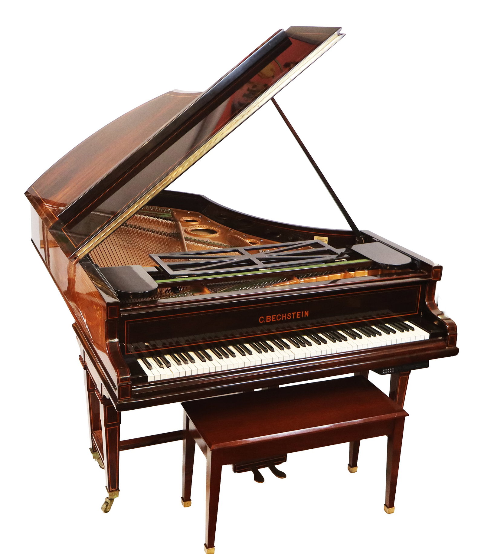 C. Bechstein Inlaid Rosewood Grand Piano: C. Bechstein inlaid rosewood baby grand piano, the case with line detail and accented with bellflower swags, ribbons and shell motifs, signed on the fallboard and plate, with a retail tag from Maximil