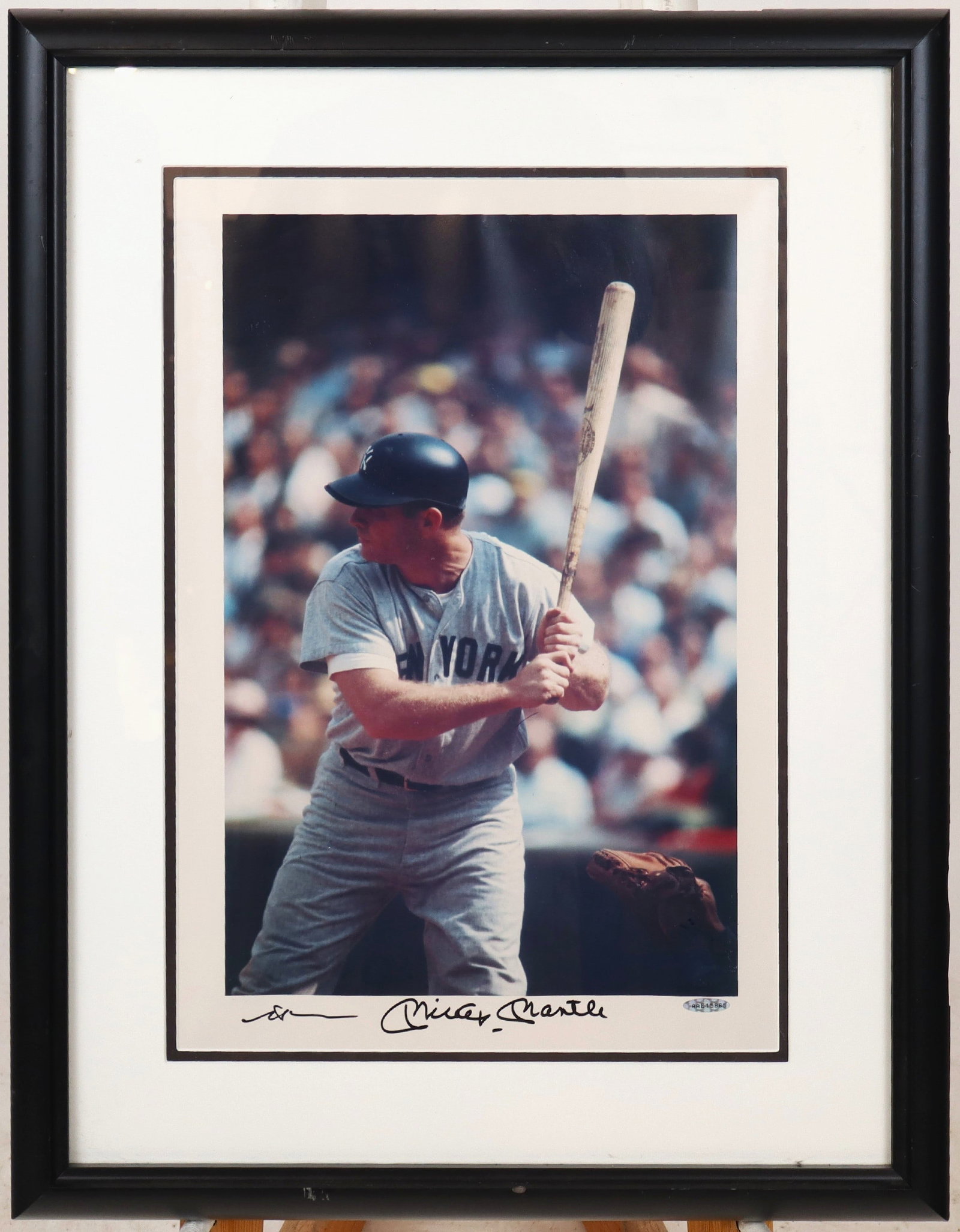 Neil Leifer & Mickey Mantle Signed Photo of Mantle: Neil Leifer (American, b. 1942) photograph of Mickey Mantle batting, signed by Leifer and Mantle in marker at lower, with identification number AAE-15865, in a frame. [Framed: 26" H x 20" W]. Conditio