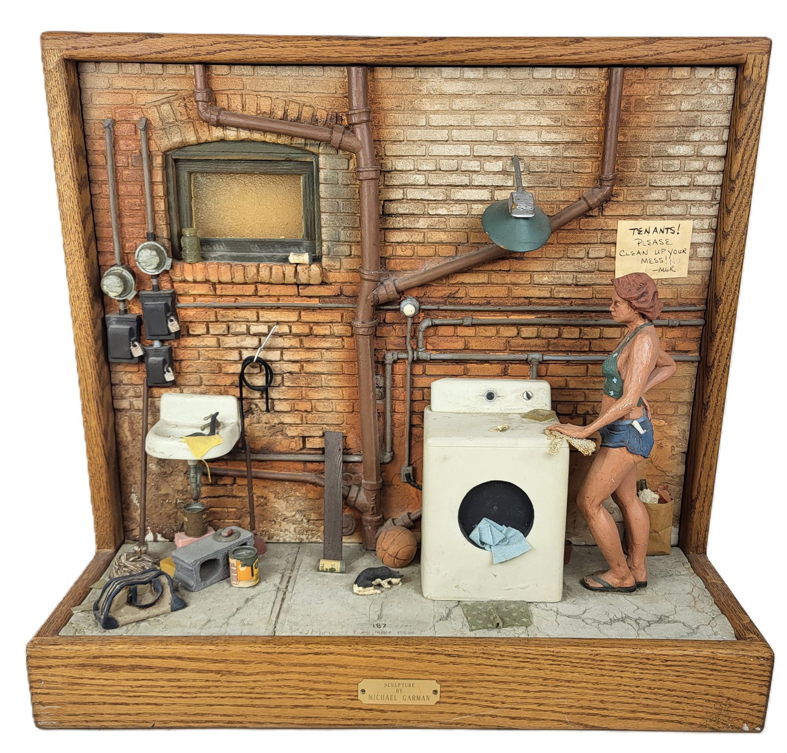 Michael GARMAN Laundry Diorama: Michael Garman (American, 1938-2021) diorama of a figure doing laundry, 1984, signed Michael Garman to lower center with edition 187/2500, and with an additional plaque affixed to lower. [21.75" H x 2