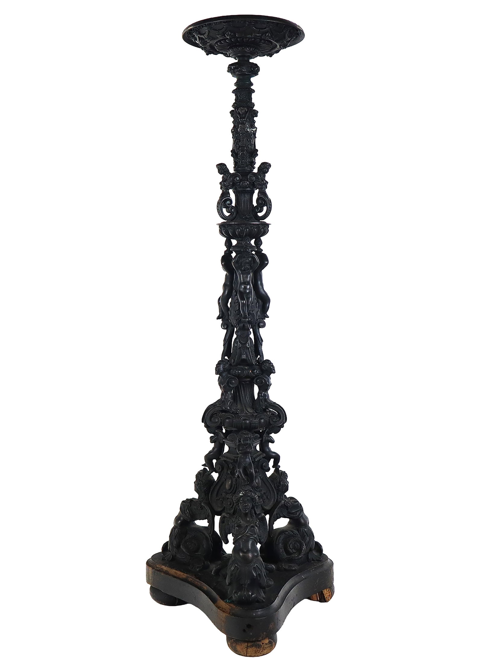 Renaissance Revival Bronze Candlesticks Stand: Renaissance Revival bronze candlestand with caryatids and cherubs, now mounted as a lamp with wood base. [28.5" H x 8.5" Diameter]. Overall condition varies, dark patina, and initially wired for elect