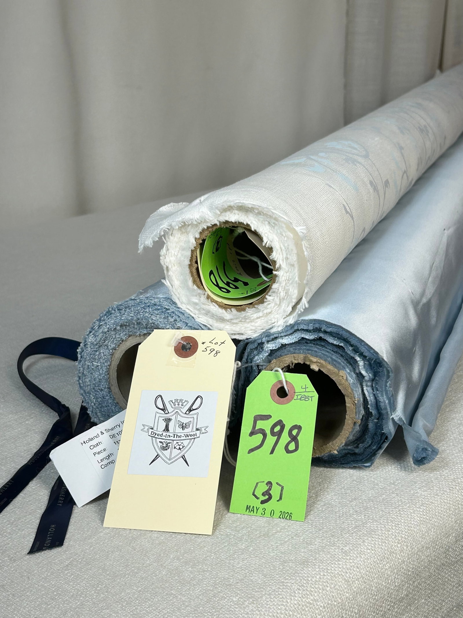 Zina Studios Print & Holland & Sherry Satin Fabric: 1) 6 yards of Zina Studios hand screen-printed stylized floral in blue and gray on bleached white linen, called "Chinon", 47" wide. The modern two-dimensional paisley has a vertical repeat of 23 1/4" 