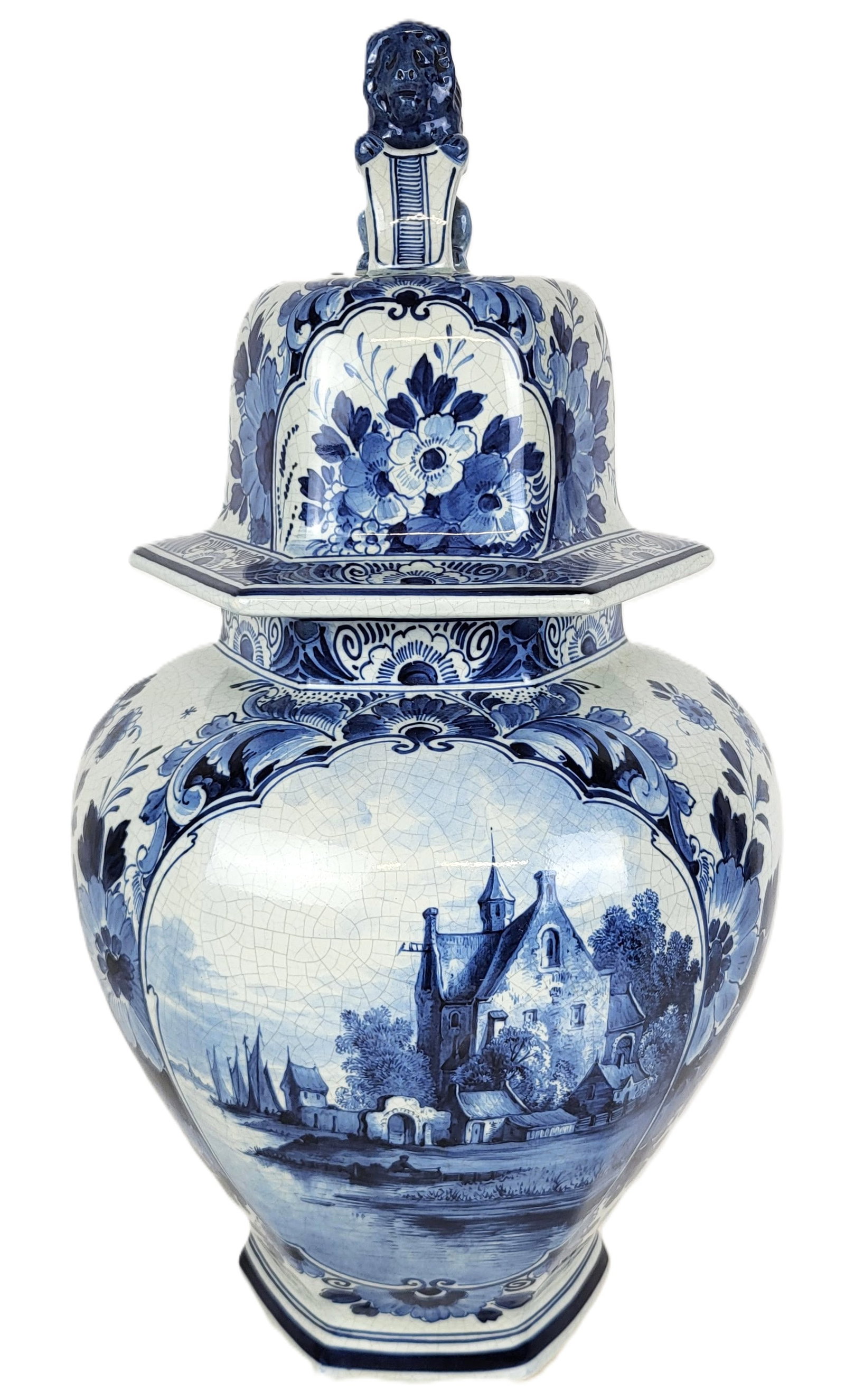 De Porceleyne Fles Deflt Faience Jar: De Porceleyne Fles Delft faience jar, circa 1900, with hand-decorated floral design, and lion finial, marked to base with De Porceleyne Fles marks and JT & L. [17" H x 9" Diameter]. Condition is good 