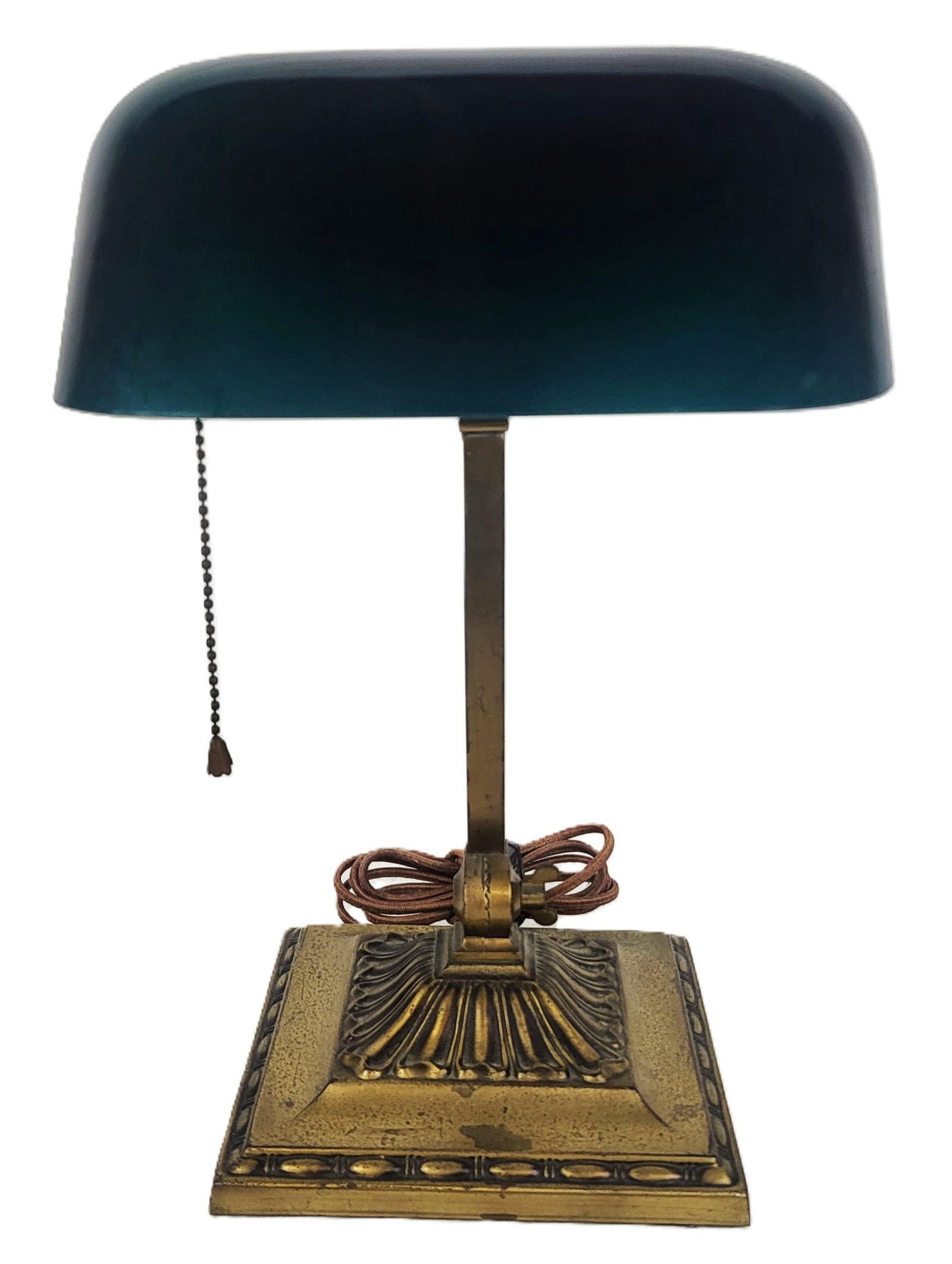 McFaddin & Co. "Emeralite" Banker's Light: McFaddin & Co. "Emeralite" brass and glass adjustable banker's light, marked on the interior arm. [13.75" H x 8.25" x 7" D]. Overall condition is fair, discolored and marked base, commensurate with ag