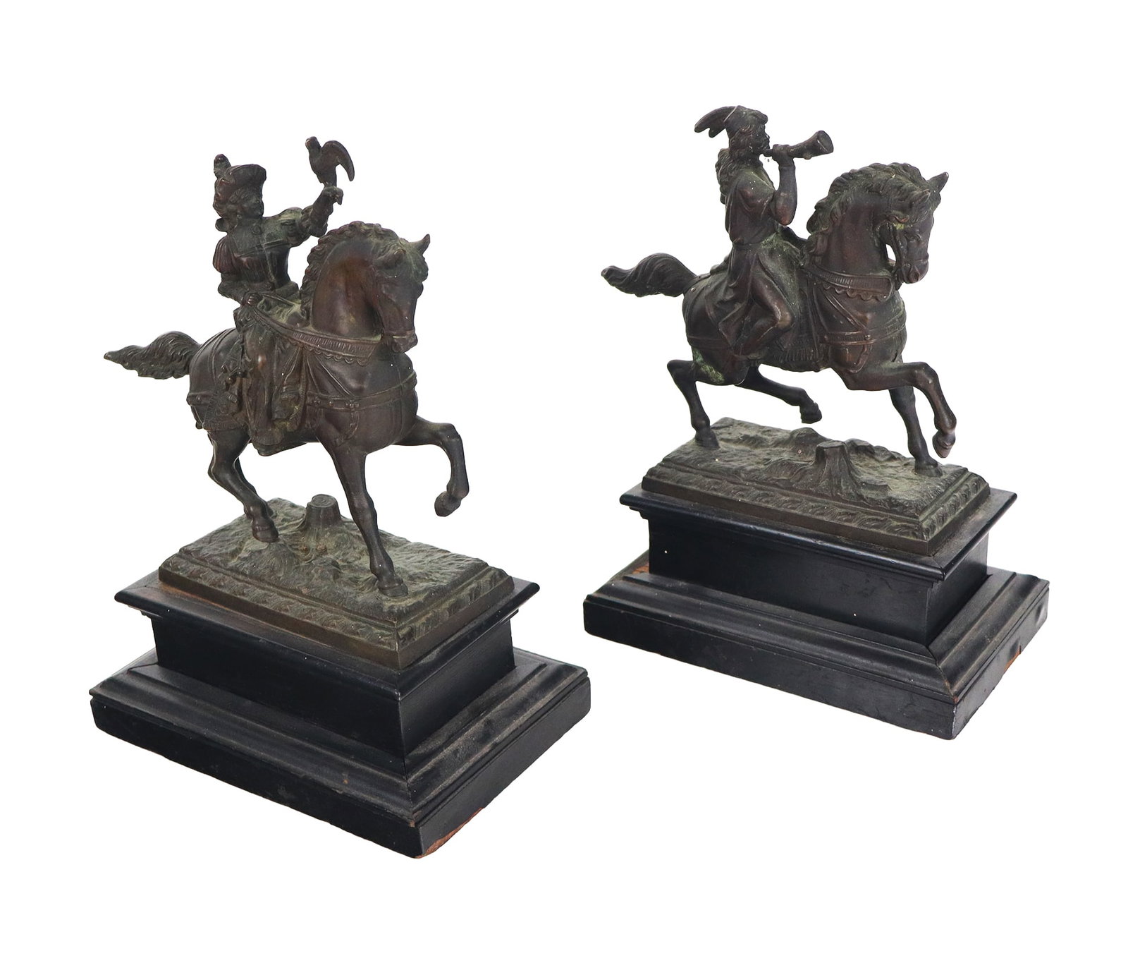 Pair of Equestrian Metal and Wood Figures: Pair of metal 19th century riders on horseback, the man with horn, the lady with hawk, all resting on a wooden base. [10.25" H x 7.5" W x 4.75 L]. Overall condition is fair, require adjustment and