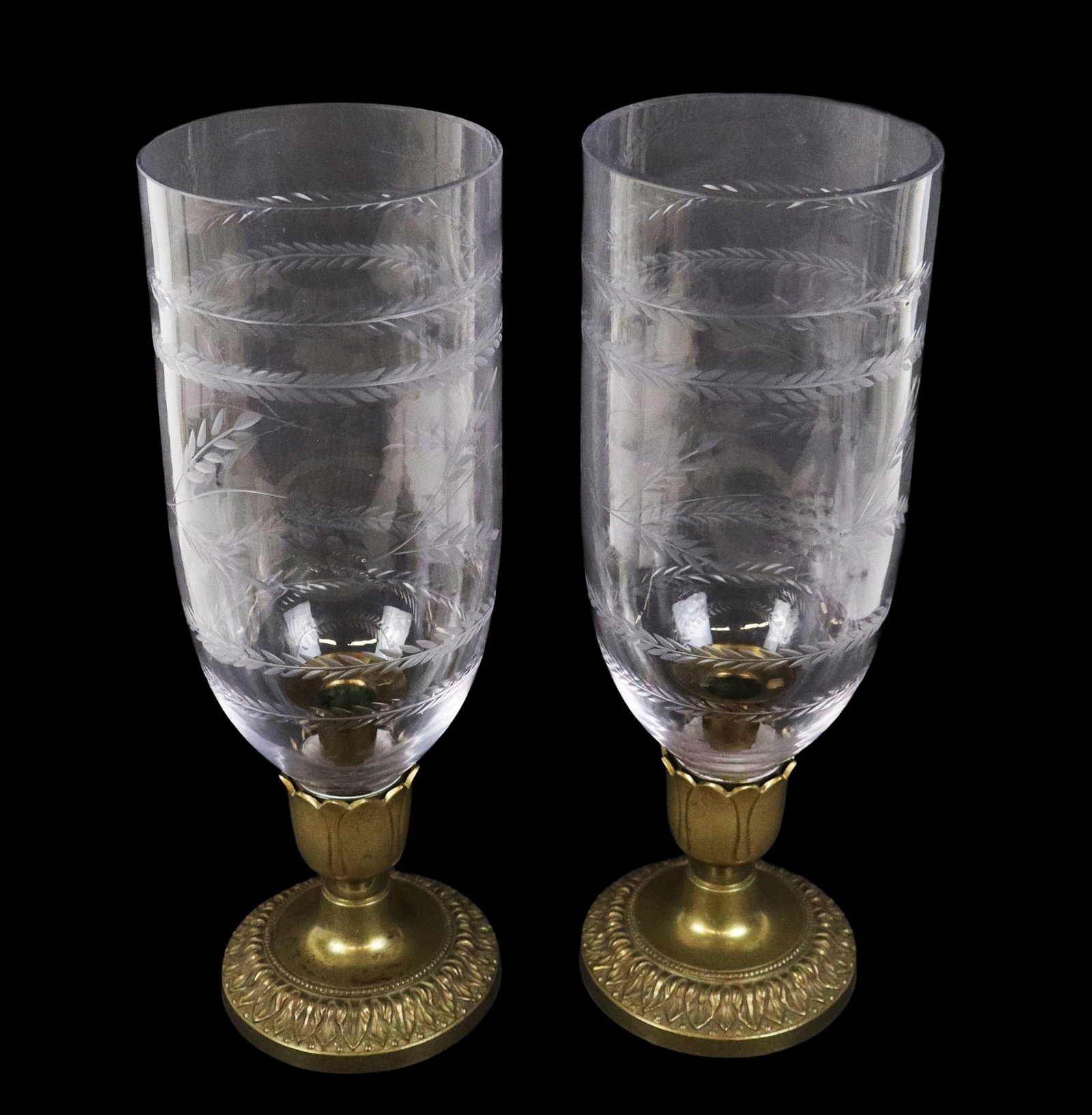 Pair Brass & Etched Glass Hurricane Candlesticks: Pair of brass foliate decorated candlesticks wheat etched glass shade, late 19th/early 20th century. [14.25" H x 4.25" Diameter]. Overall condition is good, some discoloration to base metal.