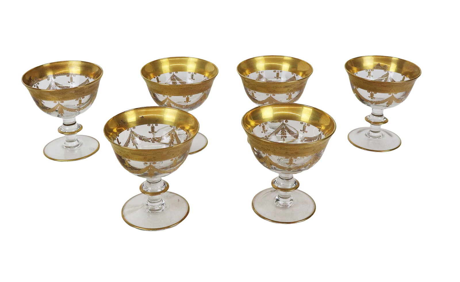 Arte Italica Medici Coupes, 6: Six coupe glasses with gilt decoration by Art Italica, Italian, 20th century, with laurel and cross decoration, unmarked. [5" H x 4.5" Diameter]. Condition is good with some minor losses to gilt decor