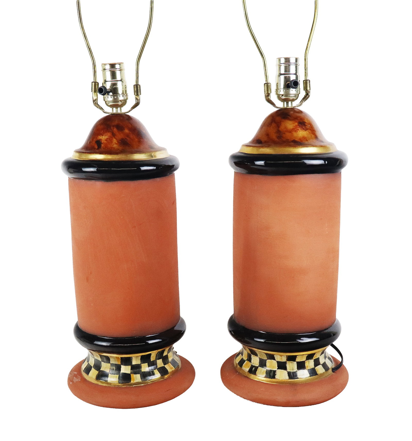 Pair of MacKenzie Childs Attributed Table Lamps: Pair of MacKenzie Childs attributed table lamps, 21st century, with painted terra cotta bases and finials, unmarked. [30" H x 8" Diameter]. Condition is good to fair with one finial with losses and in