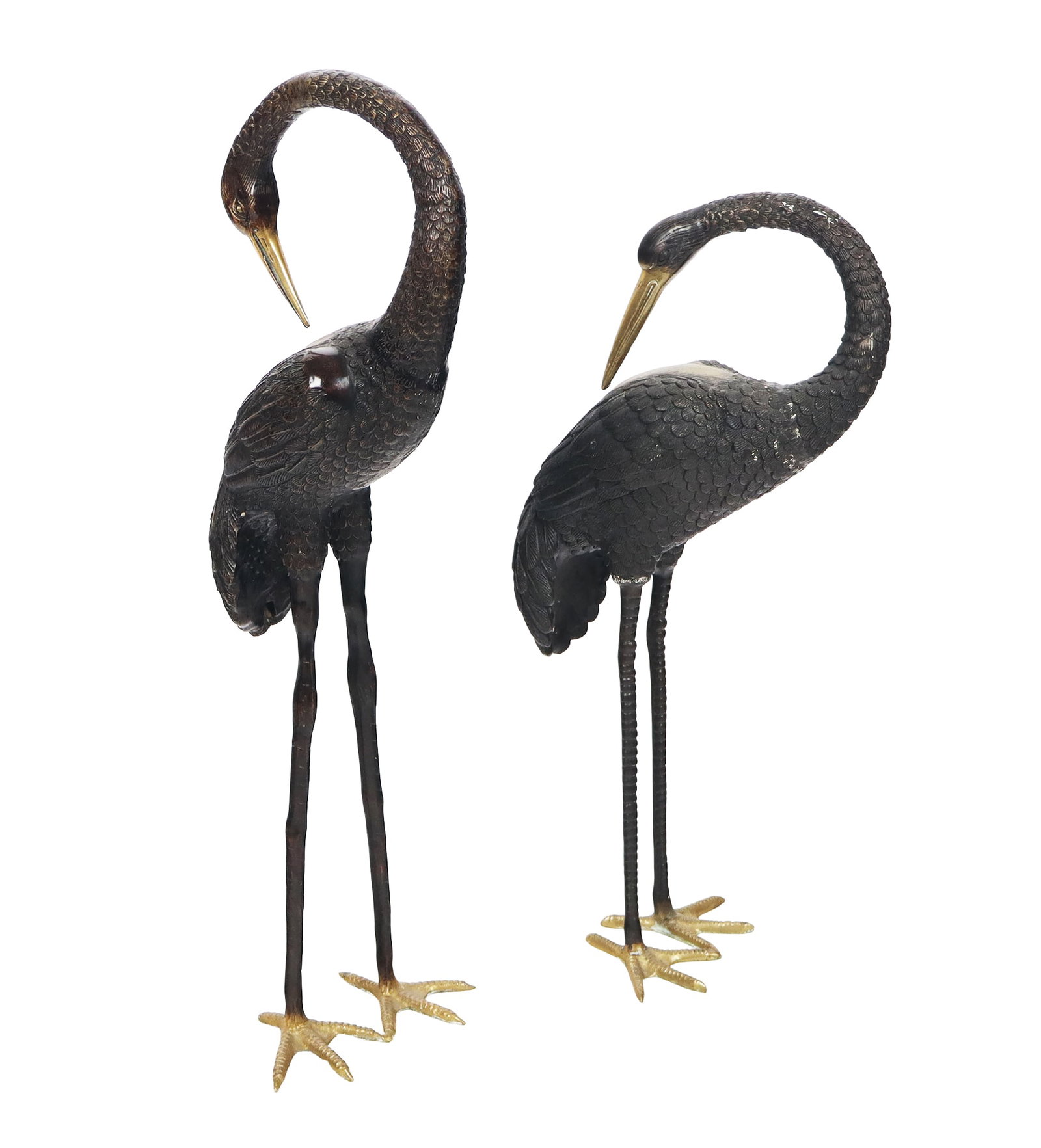 Pair of Bronze Herons: Pair of bronze herons, 20th century, with patinated finish, unmarked. [Taller: 37" H x 13" W x 11" D]. Condition to each is good. From the esteemed collection of Neil Zukerman former owner CFM Gallery
