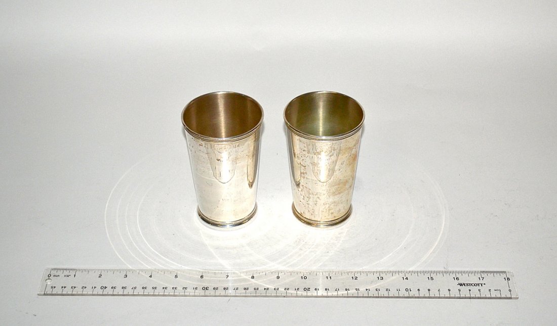 Pair of Tiffany and Co. Sterling Silver Beakers: Each taper slightly towards foot and bear beaded bands at top and bottom. [3 1/4" D x 5" H]. Total weight: 12.22 ozt.