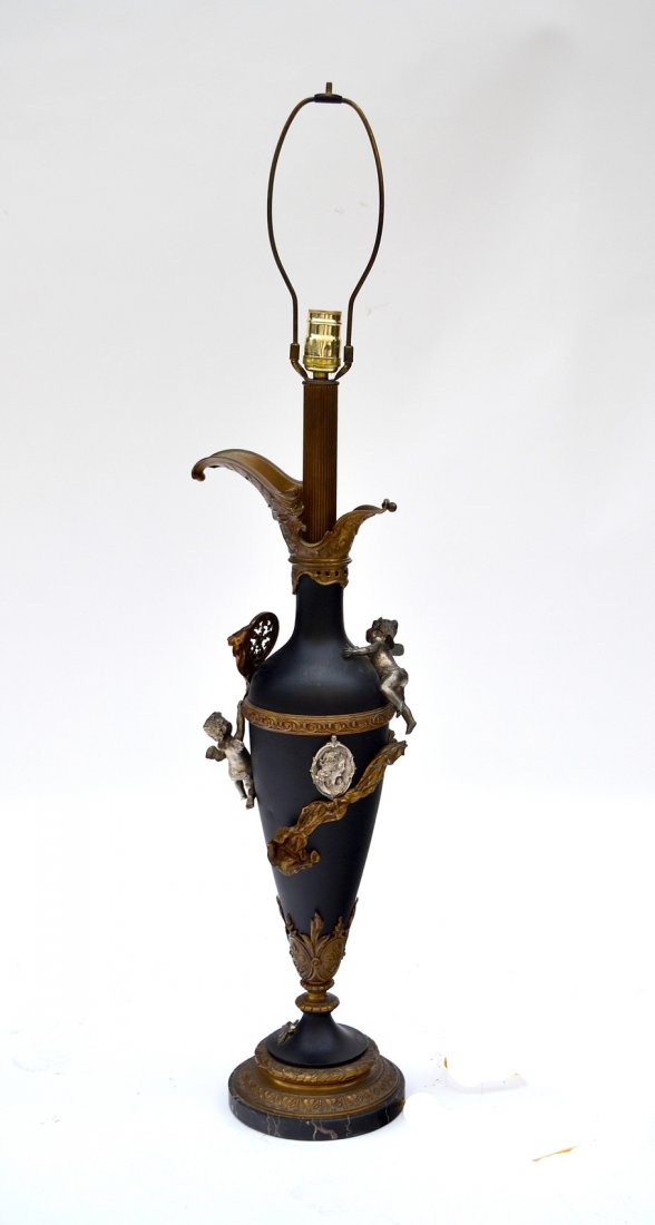 Empire-Style Tole Table Lamp: Ewer-form lamp with bronze mounts and applied putti, swag and medallion elements mounted on a black marble base. [7" D x 31" H to socket].