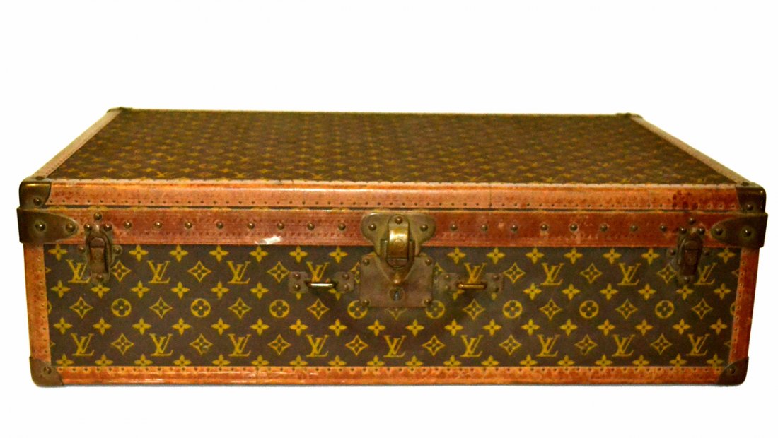 Louis Vuitton Trunk: Vintage Louis Vuitton trunk. Purchased from Saks & Co. Fifth Avenue, New York. Serial #: 872013. [29 1/4" x 19 1/4" x 8 1/2" H].