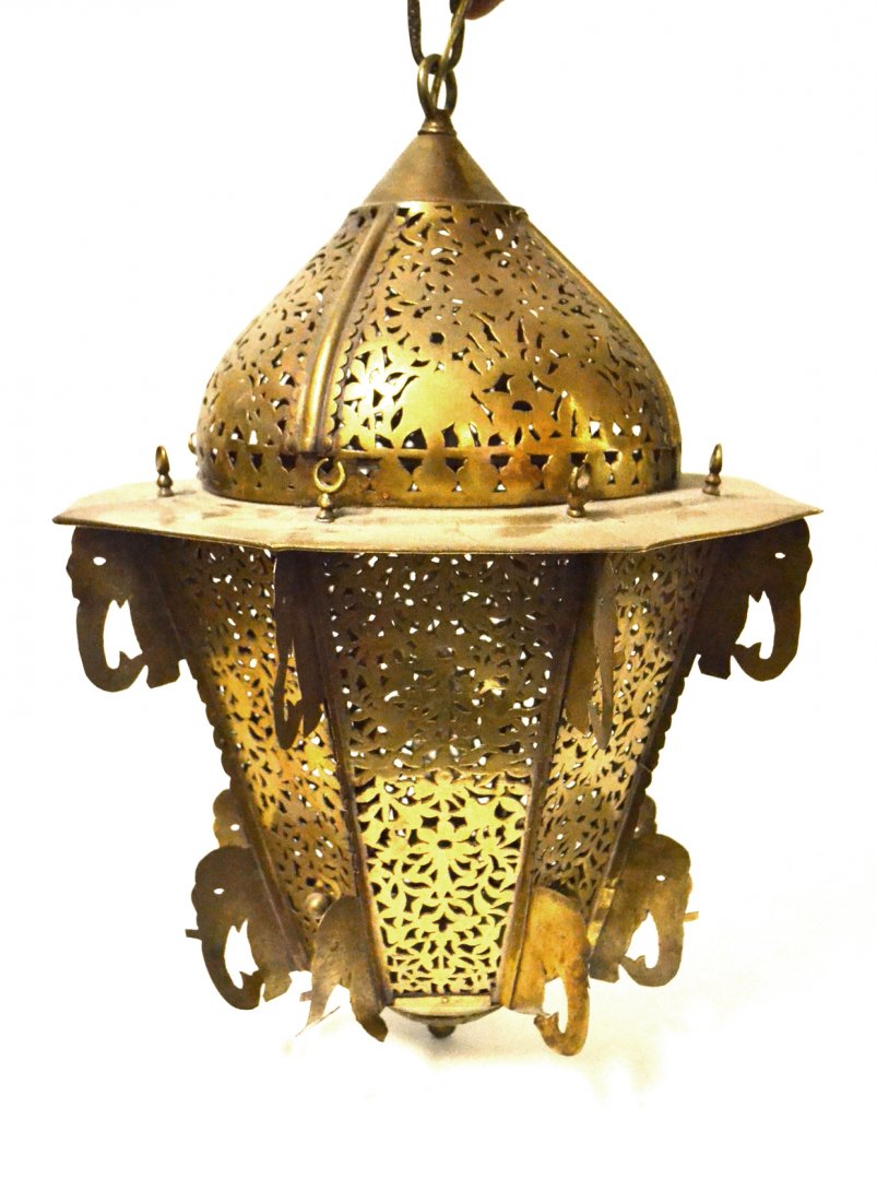 Moroccan Reticulated Lantern: Antique brass fixture having crescent moon and elephant motifs all around.